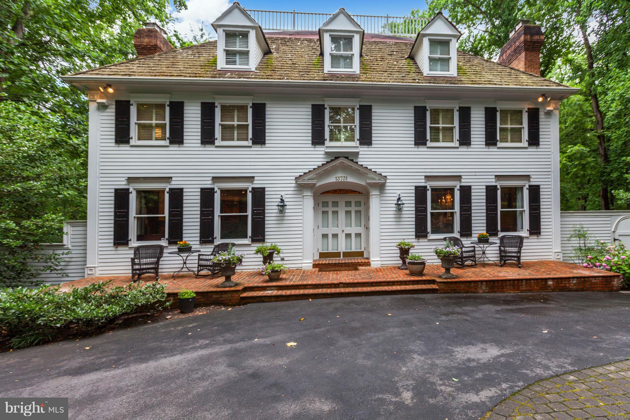 Stunning New England Colonial  with grand entertaining space -- yet a very warm and welcoming feel to gather family and friends! Exquisitely renovated kitchen flows into a  2-story great room w/incredible views. Luxurious guest suite w/all amenities, Finished LL. Huge 2 story Deck, Screened Porch, 4 car garage, Neighborhood trails to C&O Canal!