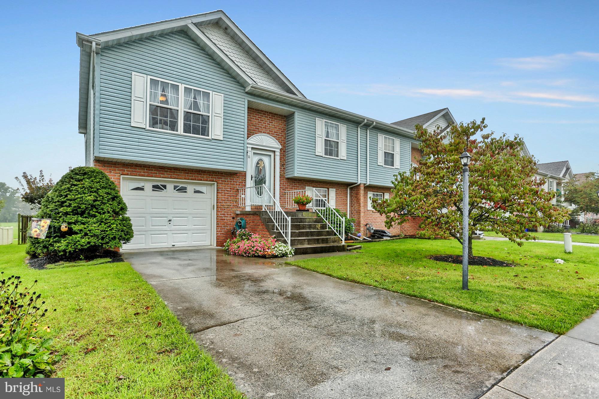 You will love the open floor plan and vaulted ceilings in this gorgeous home.  Hardwood floors, updated kitchen with Quartz counters and tile backsplash,  Brand new roof in 2017.  Deck and paver patio overlook park with walking path to the rear.  Master bedroom with vaulted ceiling, walk-in closet & access to the bath.  Finished lower level family room could be spacious master suite with full bath and laundry.