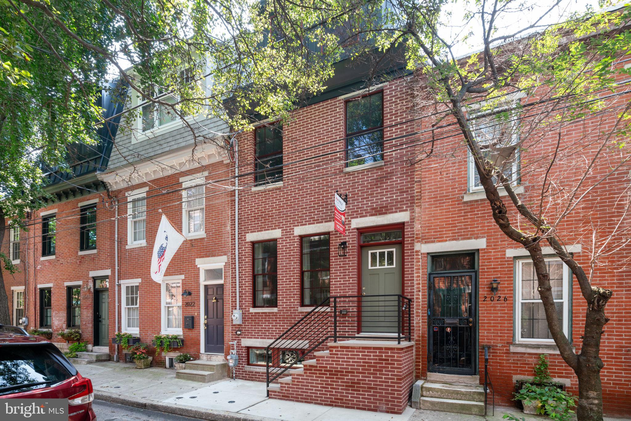 100% complete, beautifully staged, and ready for showings!  Incredible new construction opportunity on one of Graduate Hospital’s premier tree-lined blocks. This custom-built home with tax abatement by one of the city’s most experienced builders is located in the coveted Greenfield catchment and is a short walk to Rittenhouse Square, Schuylkill River Park and UPenn, CHOP & Drexel in University City.  All your boxes are checked at 2024 Kater St. with 4 beds, 3 full baths, a finished basement, chef’s kitchen, large patio, full primary suite with wet bar and roof deck with amazing skyline views. Proceed past the timeless new brick façade with 3rd floor mansard roof and enter the wide-open main level with hardwood floors, high ceilings, surround sound speakers and custom ceiling soffit with LED lighting. The rear kitchen offers quartz counters with a large island, stainless appliances, under cabinet lighting, wine fridge & a pantry. Sliding doors lead to your large private patio ideal for a BBQ or outdoor dinner with family/friends. Ascend the floating staircase to the 2nd level with large front and rear bedrooms, a hall bath with stall shower and a convenient laundry closet with stackable washer and dryer. Ascend the floating stairs again to the 3rd floor primary suite with wonderful skyline views, a huge walk-in closet with custom shelving & a 4-piece bath with double vanity, custom stall shower with frameless glass surround & soaking tub. There’s also a wet bar before you exit to the fantastic roof deck complete with unobstructed 360-degree views of the city. The finished basement has high ceilings, a front entertainment room, another full bath, and a large private rear room to use as a 4th bedroom. Simply a tremendous opportunity on one of Grad Hospital’s most picturesque blocks built by an experienced, respected developer. Approved tax abatement, 2-year warranty, roof deck, finished basement, custom finishes, built-in speakers, dual zone HVAC, Greenfield Elementary catchment, and an A+ location. Walk to Rittenhouse Square or the South St. bridge to UPenn and CHOP plus easy access to Amtrak, 76 and the airport. City living at its finest in a perfect home that will exceed all your expectations!  Will not last, schedule your showing today!