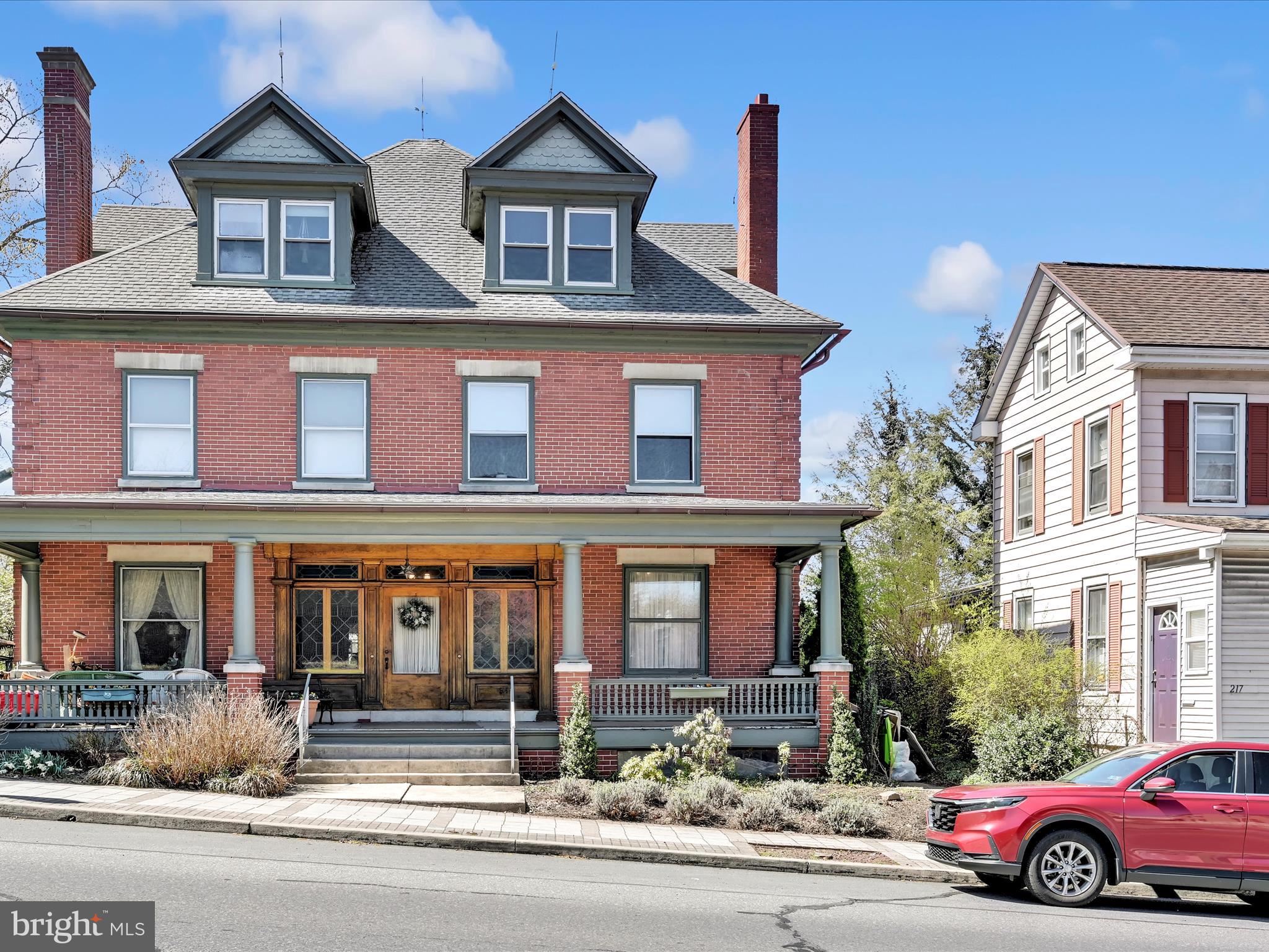 **OFFER DEADLINE MONDAY 4/21 AT NOON.**  Calling all old home lovers! Step into the timeless charm of this beautifully preserved residence, overflowing with original character and thoughtful craftsmanship. With over 2,700 square feet of living space, this home is a rare find for anyone who appreciates the elegance and soul of historic architecture.
From the moment you walk in, you’ll be welcomed by rich hardwood floors, stunning woodwork, and original light fixtures that tell a story of their own. Classic built-ins, solid wood doors, and a graceful dual staircase add both function and nostalgic beauty.
The traditional layout features spacious rooms, soaring ceilings, and large windows that flood the home with natural light. Entertain with ease in the formal dining room with pocket doors, or cozy up beside the wood-burning fireplace. Just off the kitchen, a separate pantry room offers plenty of additional storage.
Upstairs, you’ll find three generously sized bedrooms and one full bath. One of the bedrooms even includes its own private patio overlooking the backyard—perfect for a quiet morning coffee or evening unwind.
A special bonus: the third-floor efficiency apartment, accessible through the main home, offers flexible space for a home office, guest suite, or potential rental.
If you've been dreaming of a home with history, heart, and endless potential—this one is calling your name.
**This home is a semi-detached accessible through the main front door. There is a full 3rd floor apartment that is accessible only by walking through the main home. Utilities for the apartment are billed separately by the boro. Apartment has AC, rest of home uses window units.