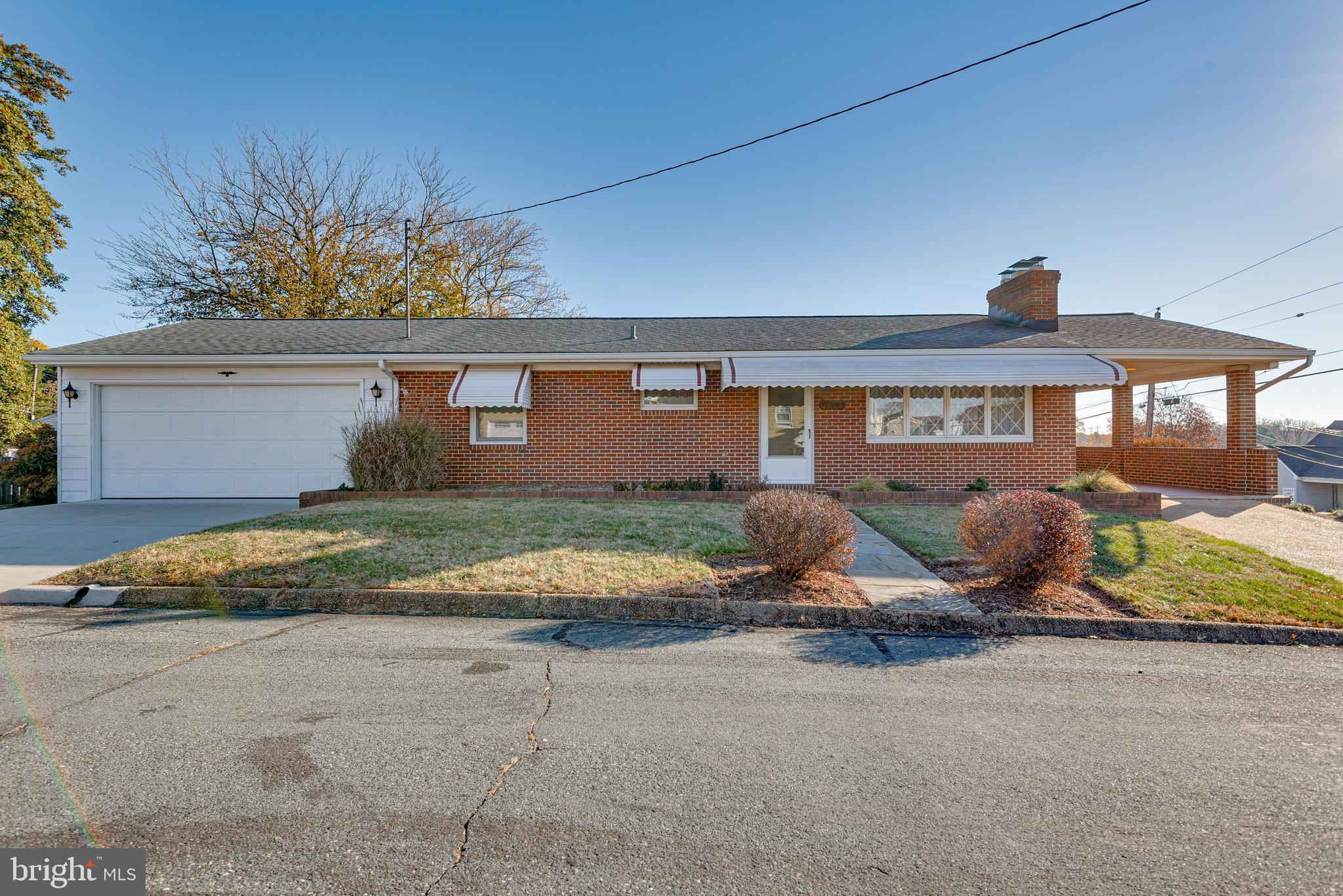 *****BACK ON THE MARKET DUE TO BUYERS FINANCING FALLING THROUGH ! ........... Spacious Rancher with Huge 2 car garage  and carport!  This home has been loved and well cared for by the original owner .  3 bedrooms on the main level and awesome finished basement with pool table and bar. 
Bonus Screened Florida room .  This home is truly a must see.   Fast settlement !!