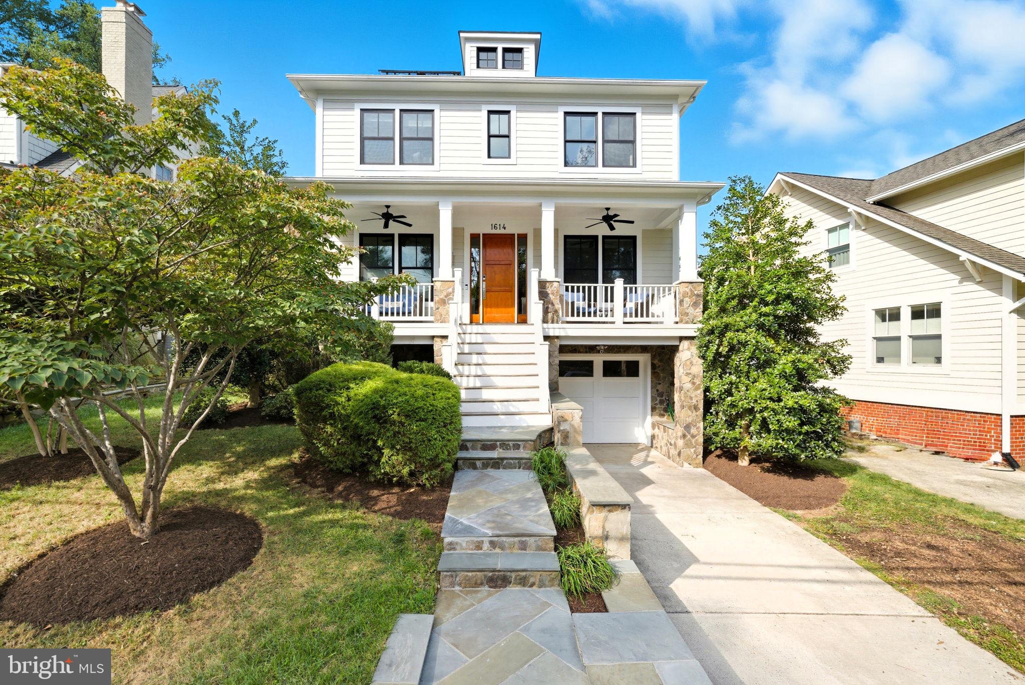 Nestled in Arlington’s highly coveted Lyon Village, this stunning 2008 farmhouse makes an unforgettable first impression with its expansive covered front porch and timeless curb appeal. Inside, soaring 10-foot ceilings, sun-drenched interiors, and gleaming hardwood floors create a warm, sophisticated welcome. The show stopping custom kitchen—complete with island seating and a walk-in pantry—opens seamlessly to an expansive family room with built-ins and a casual dining area, making it the true heart of the home. The main level is thoughtfully designed for both entertaining and everyday living, featuring a formal dining room with bay window and pocket doors, a private office with pocket doors, and a powder room. A graceful wide staircase leads to the upper level, where three spacious bedrooms each enjoy their own ensuite bath. The luxurious primary suite boasts two walk-in closets and a spa-inspired bath with a new double vanity, oversized shower, and soaking tub, along with the convenience of a bedroom-level laundry room. The fully finished basement offers exceptional flexibility with a fourth bedroom and full bath ideal for guests, a recreation room, a mudroom just off the garage, and abundant storage. A one-car attached garage, EV charging station, solar panels and inviting outdoor patio complete this exceptional residence. All just blocks from Clarendon’s vibrant shopping, dining, and Metro access—this is Arlington living at its finest.