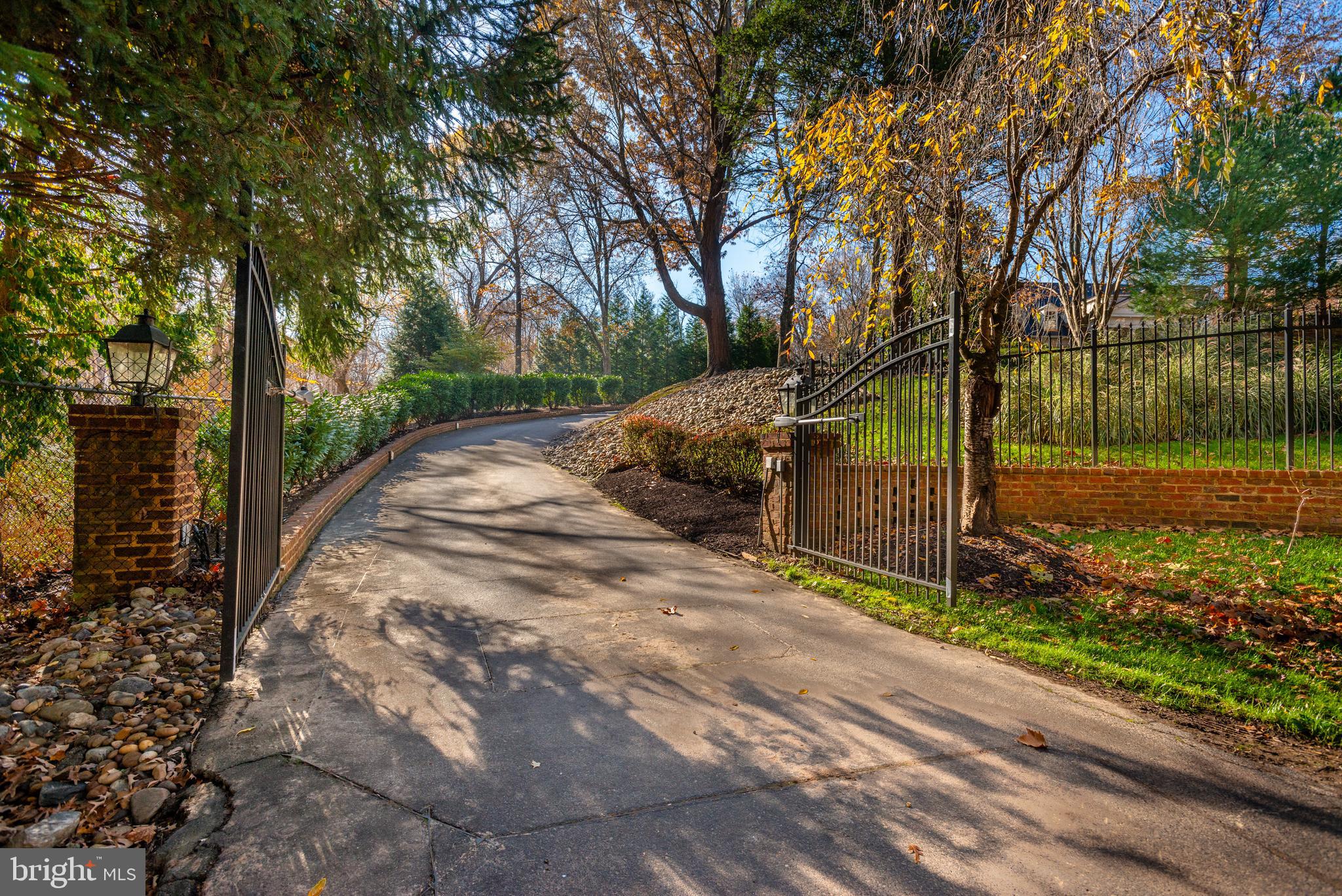 Beautiful Cullinane Georgian on 2 beautiful and private acres.  With over 11,100 sq.ft., the main residence features grand entertaining space and generous private rooms.  The main level offers a grand two story foyer, office, den, formal living room, generous gourmet kitchen with atrium, family room, 2 powder rooms, laundry, 5 fireplaces, and wide plank hardwood floors.   The 2nd level features a grand primary suite with private patio and 2 bathrooms each with their own walk-in closets.   The second level is completed by 4 additional bedrooms, each with ensuite bath.  The full lower level offers a generous recreation room w/ bar, gym with full bathroom, and plenty of storage.  The main residence has an attached two car garage.  There is an additional separate detached 2-car garage with full bathroom and apartment above. The private lot set among mature trees is highlighted by a gate, pool and tennis court.  Perfect opportunity to update through-out and make your own. Property sold in AS IS condition.