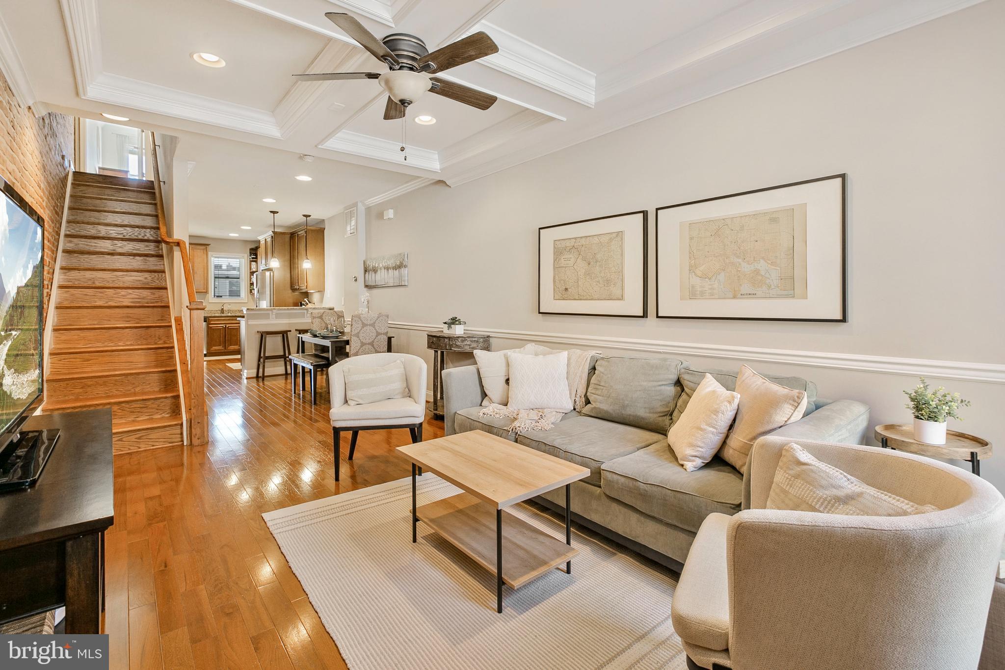 CHAP TAX CREDIT RENOVATION W/ EASY OFF STREET PARKING & REMARKABLE VIEWS FROM ROOF TOP DECK - this renovation features an open floor plan with hardwood floors, exposed brick, an abundance of trim detail with coffered ceiling, crown molding & chair rail all leading to stylish kitchen with granite counter tops, ss appliances and convenient breakfast bar. Upper level offers two bedrooms suites, laundry area and double bowl owner suite vanity w/ hallway access to roof top deck and the best views in Canton! Fully finished basement - approx. 2 years remaining on chap tax credit, current taxes $3285/year!