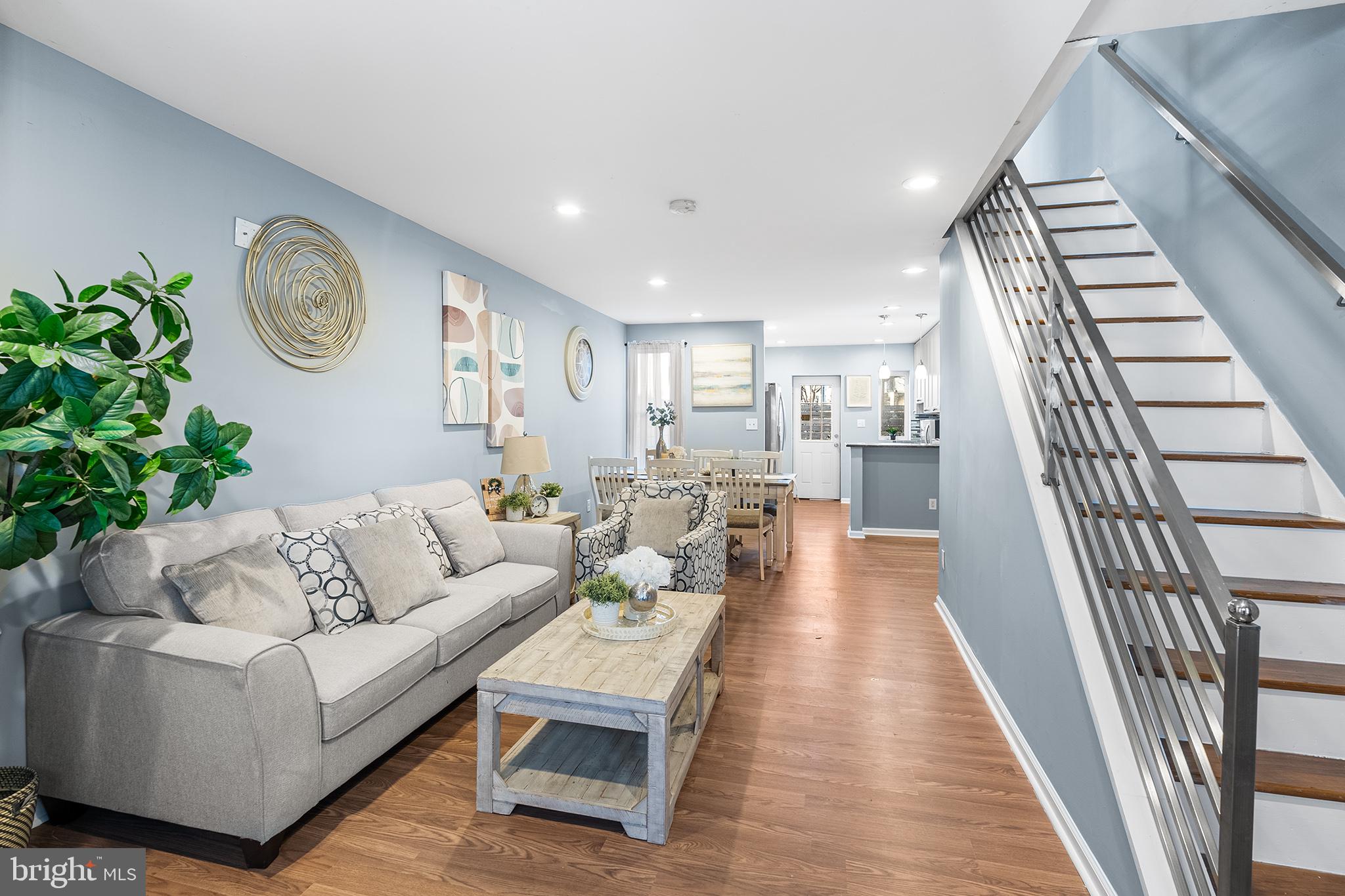 Welcome to this stunning, renovated home in South Philly! With its extensive remodel in 2018 and recent updates, this home has been beautifully maintained and improved - this property is a rare find. The inviting front porch, perfect for outdoor seating, sets the tone for the beautifully designed interior. Inside, you'll discover an open floor plan featuring a spacious living and dining area that seamlessly flows into a modern kitchen. The kitchen boasts 42" raised panel cabinets, granite countertops, tile backsplash, and recessed lighting. The back door provides effortless access to the rear patio, ideal for summer BBQs and outdoor entertaining. The upper floor showcases three generously sized bedrooms and a beautifully updated bathroom. The fully finished basement offers additional living space, including a full bathroom, office area, and ample storage. Recent upgrades include luxurious vinyl flooring on the first floor, freshly painted bathrooms with new mirrors and sinks, a new hot water heater (2024), and newly painted façade. The property also features new gas heat and central air conditioning system installed in 2018. Conveniently located near shopping, groceries, public transportation, and mere seconds from Route 76, this incredible home has it all. Don't miss your chance to own this gem – schedule a showing today!