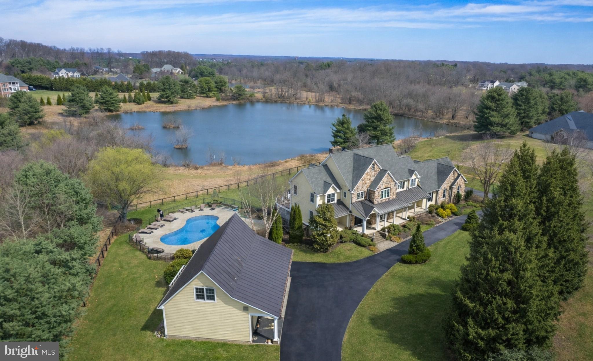Beautiful Custom Home in Highland Set on a Very Private Lot Overlooking Multiple Large Ponds**  Three Finished Levels with Over 7000 Finished Square Feet** Main Level Features an Open Floorplan with 10' & Vaulted Ceilings / Cherry Wide Plank Hardwoods / Custom Designed Kitchen / Step Down Family Rm with Stone Gas Fireplace / Two Offices / Formal Living & Dining Rooms / Two Powder Rooms & a Mudroom Leading to the Rear 3-Car Garage** Top Floor Includes 4Beds / 3Full Baths & Additional Bonus Rm over the Garage - 9' & Vaulted Ceilings Entire Level** A Stunning Staircase then Leads to an Entertainer's Delight for a Finished Lower Level Showcasing a Full Custom Bar Area / Discreet Wine Cellar / Mahogany Media Rm with All Equipment & Furniture / Game Room with a Stone Wood Burning Stove / Exercise or Additional Bedroom & Full Bath & Large Storage Area ***  From the Finished Lower Level Step out to the Covered Rear Porch / Deck Areas & Fenced Pool ** The Pool Includes a Waterfall / Third Stone Fireplace & Numerous Other Features & Beautiful Private Views ***  In addition to the Main Home - The Property Also Includes an Oversized Detached Garage / Professional Workshop with an Office & Additional Powder Room Above ** New Architectural Shingle Roof w/Lifetime Warranty / 3-Zone Heating & Cooling Systems *** Sited on just under 1.5 Acres on a Very Quiet Cul-De-Sac in Highland - You Will Not Find a Better Constructed Custom Home with this Amazing Rural Setting!!          Showings will begin Thursday 4/9*