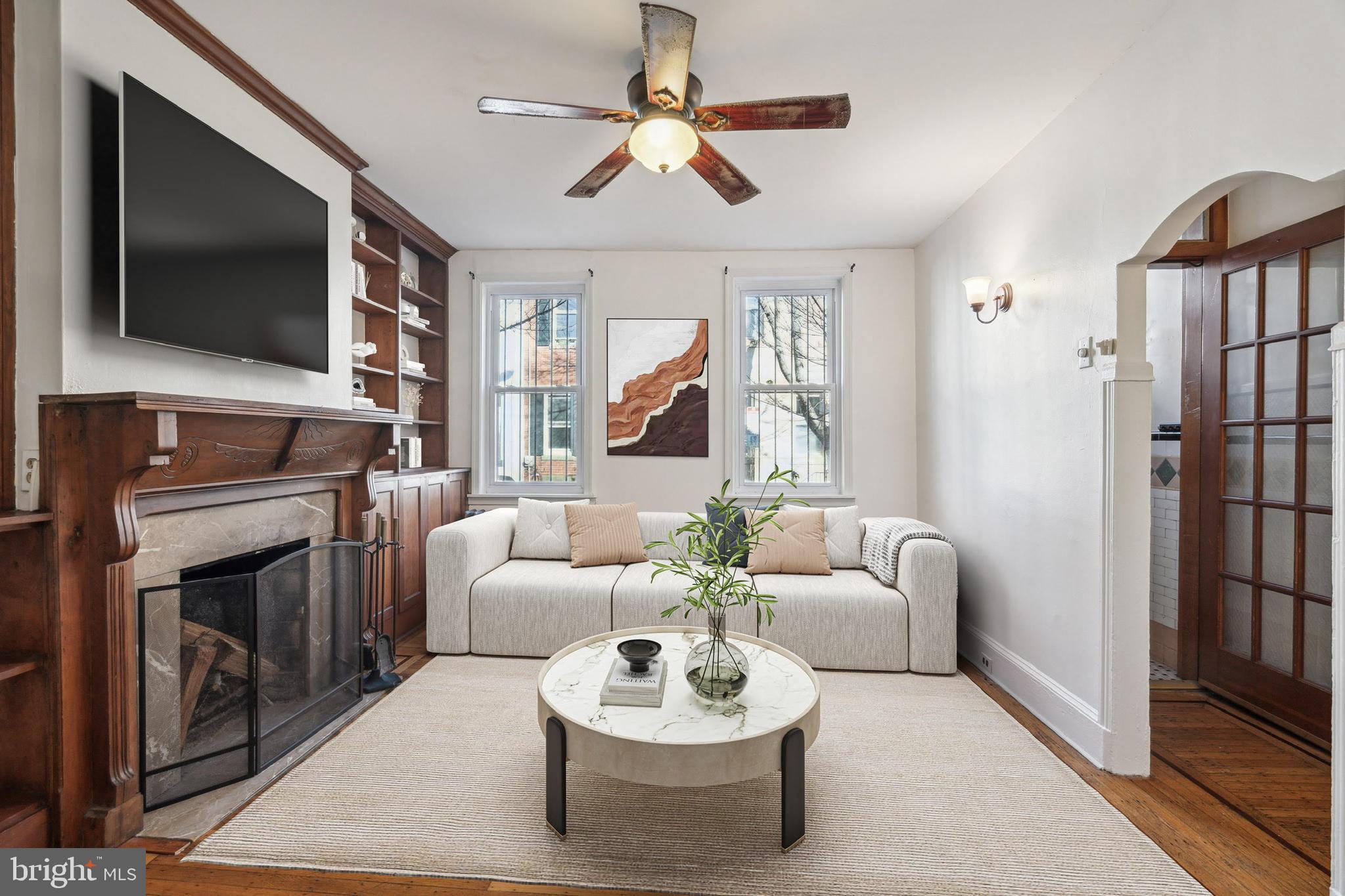 Welcome to 1822 Montrose St, situated on a lovely block in Graduate Hospital. This one of a kind 16 ft wide home offers 3 spacious bedrooms, old-world charm and original character. The tiled vestibule has metal wainscoting and is the perfect transition into your home. The living room is warm and inviting with built-in shelves and a working wood fireplace. The original hardwood floors with inlays flow into the dining room with a closet. The large kitchen has stainless steel appliances, an island with seating, lots of natural light and convenient laundry. The back deck has plenty of room for seating and a grill or planters. Upstairs all 3 bedrooms are good sized with usable closets and original hardwood floors in two.  The bright hall bathroom has a claw foot tub and vanity with storage. The tall unfinished basement has a brand new water heater and is great for storage or could be finished if desired. Ideally located in Graduate Hospital, a short walk to Rittenhouse Square and Lincoln Square with Target, Sprout’s and more. Other local favorites in short walking distance include L’anima, Chick’s, Loco Pez, Ultimo Coffee and so much more.  Ask about 6.375% PHFA loan option.