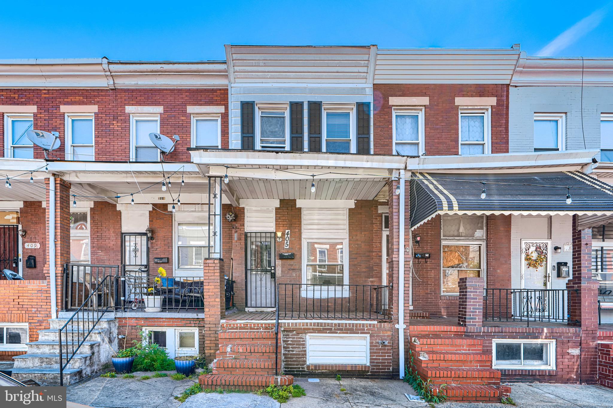 PRICE ADJUSTMENT on this nicely updated Baltimore porch front row home provides solid options for a  buyer looking for entrance into homeownership or savvy investor looking for cash flow.  Newly updated kitchen with white cabinetry and stylish counters offers a thoughtful layout to maximize storage and functionality.  Neutral engineered flooring with fresh paint.  3 sizable bedrooms (one is a walk thru)  and update bath on the upper level.  Finished lower level with updated bath offers extra space for office, exercise, tv or rec space.  Convenient to commuter lines,  Minutes from Johns Hopkins hospital, downtown Baltimore. 895/83.  Walkable to grocery and other conveniences.  Don't delay!