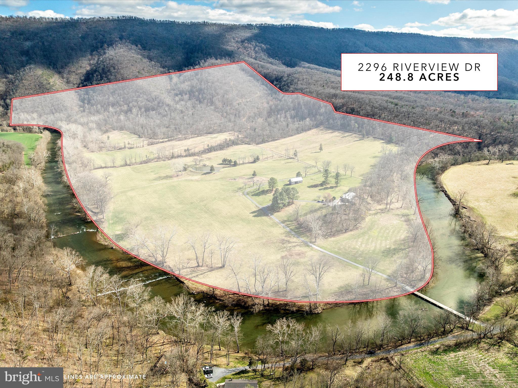 Welcome to one of the most unique properties in the Shenandoah Valley. This stunning riverfront retreat in the heart of Shenandoah County feels like a private island, accessible via your own bridge, ensuring unmatched peace and seclusion. 

Outdoor enthusiasts will find endless opportunities for adventure, with activities such as hiking, biking, hunting, fishing, kayaking, and canoeing right at your doorstep. Spanning more than 248 acres, this property is nestled in the George Washington National Forest, and boasts 1.3 miles of riverfront along the North Fork of the Shenandoah River. 

With 50 acres of open land currently used for haying, and 200 wooded acres featuring miles of hiking, ATV, and horse trails, you have direct access to thousands of acres of national forest hiking trails. The property hosts a wide array of wildlife, including bald eagles, ducks, deer, turkeys, foxes, river otters and many other native animals. 

The charming two-story home, once owned by renowned sculptor Felix de Weldon (creator of the Iwo Jima statue at Arlington National Cemetery), features four bedrooms with private baths, a spacious open living area with a striking two-sided wood fireplace, a fully-equiped kitchen, a breakfast nook, and a dining room. Floor-to-ceiling glass and Pella doors seamlessly blend indoor and outdoor living, allowing you to soak in breathtaking 360-degree views that make the surrounding landscape feel like an extension of your home. 

Step out to the large front deck, where you can enjoy panoramic views of the river and the pastoral beauty of Shenandoah Valley against the backdrop of the western mountains. From the rear patio, watch the sun come up over the majestic Massanutten Mountain Range, showcasing a picturesque pre-Civil War log barn, lush pastures, a half acre pond stocked with bass and catfish, and the vast George Washington National Forest on the horizon. 

The lower level of this exquisite home includes two bedrooms with baths, a cozy living area with a wood stove, a small wine cellar, a utility room, and a two-car garage. A concrete patio connects directly to paths down to the river and up to the mountains, offering the same stunning vistas of the river, valley, and mountains.  


Located on a gated private road, viewing this exceptional retreat requires 24-hour notice. 

Access is by appointment only and accompanied by the listing agent.