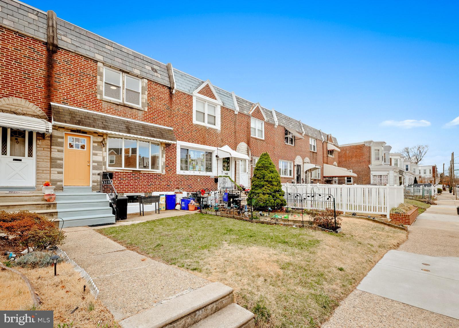 Welcome to this beautifully remodeled row home in the Wissinoming section of Philadelphia! This home has been completely updated from top to bottom, including a brand-new HVAC system, eliminating the old boiler and radiators. As you approach, you'll notice the inviting front yard. Step inside to find refinished original hardwood floors in a neutral tone, fresh paint, and recessed lighting throughout. The main level features a newly renovated partial bath, leading into the dining area, which overlooks a stunning kitchen. This thoughtfully designed space boasts a large island, quartz countertops, an aqua-tiled backsplash, two-tone shaker cabinets, and stainless steel appliances—perfect for the home chef, offering ample counter space. Upstairs, you'll find three generously sized bedrooms, all with refinished original wood flooring and fresh neutral paint. The beautifully updated full bathroom completes this level. The fully finished basement offers additional living space with new carpeting, fresh paint, recessed lighting, and a separate laundry area. You'll also find a new hot water heater, a brand-new HVAC system with all-new ductwork, and an updated electrical panel. The rear entrance provides access to a private driveway and an attached garage. This home has been practically rebuilt down to the studs and is conveniently located near major roads, bridges, public transportation, and shopping. Don’t miss this incredible opportunity—schedule your showing today!