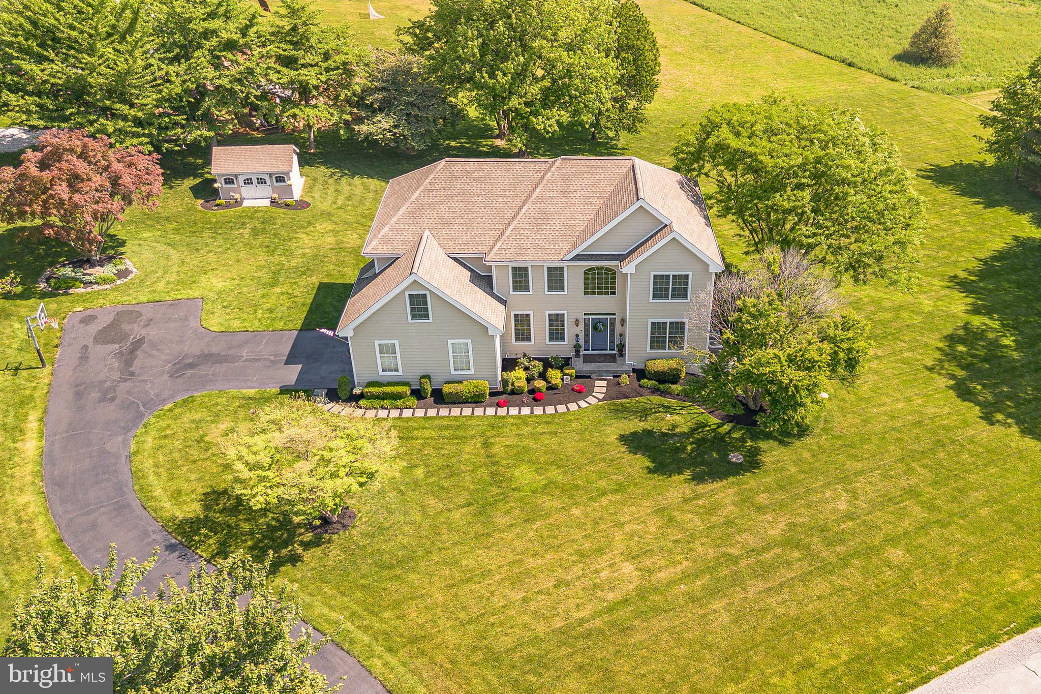 Welcome to 168 Walnut Run Road — a beautifully updated, move‑in ready 4‑bedroom, 3.5‑bath home offering over 4,400 sq ft of finished living space on one of Landenberg’s most desirable, flat, fully usable 1‑acre lots. Thoughtfully upgraded with a fully renovated kitchen, new roof, new septic system, new composite deck, new first‑floor flooring, fresh paint, and generator, this home delivers the rare combination of premium outdoor space, modern updates, and long‑term peace of mind in the highly rated Kennett Consolidated School District. An expansive 6‑car driveway and 2‑car garage set the tone for the property’s generous scale. Inside, an impressive two‑story foyer with a split staircase opens to brand‑new luxury vinyl plank flooring that flows throughout the main level. The living and dining rooms feature elegant millwork and abundant natural light, creating a refined and welcoming entry experience. A private home office sits just off the foyer and shares a double‑sided gas fireplace with the dramatic great room. With vaulted ceilings, skylights, and direct access to the deck, the great room offers a bright, open setting ideal for everyday living and entertaining. The fully renovated eat‑in kitchen showcases custom cabinetry, quartz countertops, an island with seating, stainless steel appliances, pantry storage, and generous workspace — a true centerpiece for gatherings. A convenient laundry room with driveway access and a powder room complete the main level.
Upstairs, the expansive primary suite features two walk‑in closets, a sitting room, and a spacious en‑suite bath with double vanities, soaking tub, and step‑in shower. Three additional bedrooms and a full hall bath complete the second floor. The fully finished walk‑out basement adds exceptional versatility with a large family room, bonus room, full bathroom, flex space, and a dedicated storage room with direct backyard access. Outside, the flat, private 1‑acre lot is a standout — ideal for a future pool, outdoor kitchen, sports court, or expansive patio. A composite deck overlooks the yard, and a full‑property electric dog fence adds convenience. With major systems already replaced, a premium lot rarely available in Kennett Schools, and over 4,400 sq ft of finished space, this home is truly move-in ready and built for long-term value.