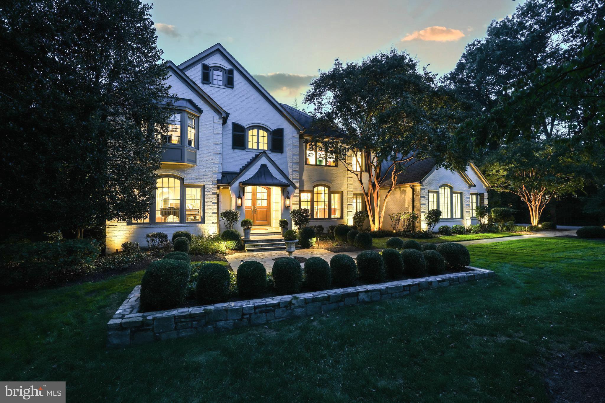 Discover unparalleled luxury and exquisite craftsmanship in this extraordinary home! Meticulously designed and re-constructed by a collaboration of skilled architects, designers, and passionate owners, every aspect of this residence reflects timeless elegance located in the top-rated Langley School District.

Approach through a captivating walkway with reclaimed European cobblestone, setting the stage for a truly enchanting entrance. As you near, the warm glow of gas lanterns flanking the arched mahogany front doors, fitted with Rocky Mountain hardware, welcomes you to a world where timeless elegance meets modern luxury. Enter the grand yet inviting foyer, featuring a hand turned, curved staircase illuminated by the Mansard Tole Lantern flanked by formal living and dining rooms.

The chef's dream kitchen with a wealth of natural light boasts a Wolf dual fuel range, Miele appliances, Pennville cabinets, spacious marble island, and more. The adjacent Hearth Room features a stone fireplace and built-in cabinetry with hidden workstations. The family room, adorned with a large stone fireplace, opens to a screened porch. The mudroom, accessible from the 3-car sideload garage, features custom lockers, a family powder room, and a room with a pet shower.

The Owner’s Retreat is a true oasis, complete with a sitting area, Juliette balcony, built-in cabinetry with a hidden desk, and a seamless entry to the primary bath. Custom his and her closets offer thoughtful features, and the primary bath is a masterpiece with dual sinks, ample storage, a two-place shower, Waterworks bathtub, Perrin and Rowe hardware, a dressing table, and heated flooring.

Additional bedrooms on this level are all en-suite with high-end baths, custom closets, and special features. A laundry room and family staircase complete this level. The lower level features a professional-grade gym, a guest suite with a private bath, a spacious family room with a stone fireplace and access to the Outdoor Living Room. A spa-like bath, locker area, steam shower, second laundry room and a surprise stage room with stage lights and a green room add to the allure.

This resort-like backyard offers an unparalleled retreat, creating an atmosphere of relaxation and entertainment for an idyllic lifestyle complete with living room with a gourmet kitchen, saltwater pool, 10-person spa, stone fire pit, and lush landscaping.

Control 4 home automation and whole home sound distribution, lawn irrigation, copper gutters, wide architectural molding, six-inch rift and quartered oak floors, and four wood-burning fireplaces enhance this property. Conveniently located near shopping, dining, and commuter routes, this cul-de-sac based Reston neighborhood with no through streets offers the epitome of luxury living. Schedule your visit now and unlock the door to your dream home!