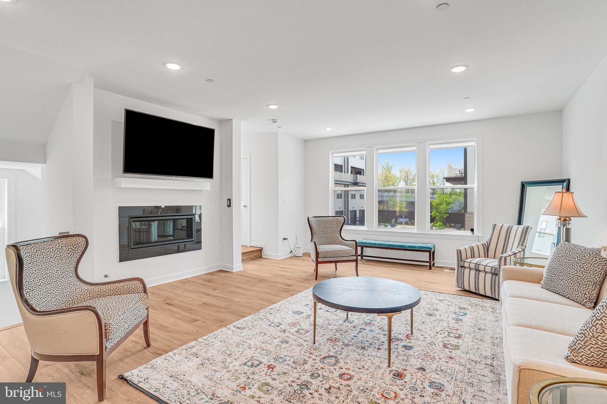 Experience elevated living in this like-new, barely lived-in corner-unit townhome nestled in The Boulevards at Westfields. This sought-after Bennington II model by K. Hovnanian offers 5 spacious bedrooms and 4.5 beautifully appointed bathrooms, thoughtfully designed for both style and functionality.
Perfectly positioned on a premium corner lot, the home is bathed in natural light thanks to additional windows that create a bright, airy ambiance throughout. The heart of the home is a sophisticated gourmet kitchen, featuring high-end appliances, sleek finishes, and a generous center island—ideal for entertaining or casual everyday living. Just off the kitchen, a versatile main-level office or sitting area provides the perfect space for working from home or relaxing.
A sun-drenched sunroom offers a peaceful retreat for morning coffee or unwinding at the end of the day. Step outside to an impressive two-level deck, creating exceptional space for outdoor entertaining and enjoying scenic views.
The top-level loft adds incredible flexibility, featuring a private bedroom, full bathroom, and a comfortable sitting area—ideal for guests, an au pair suite, or multi-generational living.
The corner location enhances both privacy and outdoor living potential, making this home a truly rare and desirable opportunity in a highly sought-after community.