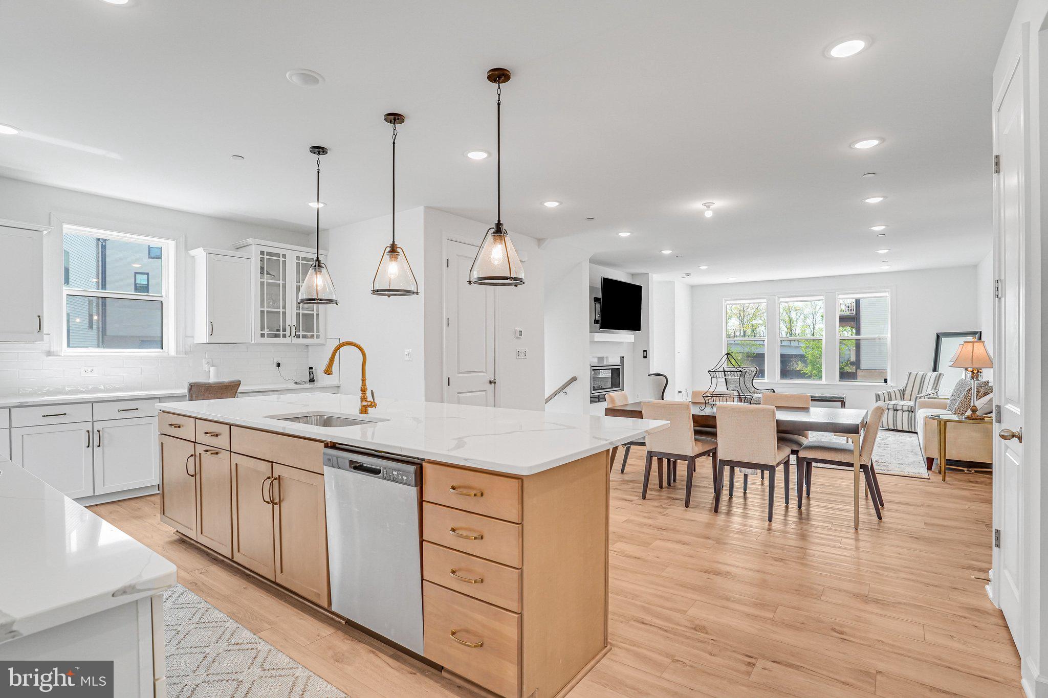 Experience elevated living in this like-new, barely lived-in corner-unit townhome nestled in The Boulevards at Westfields. This sought-after Bennington II model by K. Hovnanian offers 5 spacious bedrooms and 4.5 beautifully appointed bathrooms, thoughtfully designed for both style and functionality.
Perfectly positioned on a premium corner lot, the home is bathed in natural light thanks to additional windows that create a bright, airy ambiance throughout. The heart of the home is a sophisticated gourmet kitchen, featuring high-end appliances, sleek finishes, and a generous center island—ideal for entertaining or casual everyday living. Just off the kitchen, a versatile main-level office or sitting area provides the perfect space for working from home or relaxing.
A sun-drenched sunroom offers a peaceful retreat for morning coffee or unwinding at the end of the day. Step outside to an impressive two-level deck, creating exceptional space for outdoor entertaining and enjoying scenic views.
The top-level loft adds incredible flexibility, featuring a private bedroom, full bathroom, and a comfortable sitting area—ideal for guests, an au pair suite, or multi-generational living.
The corner location enhances both privacy and outdoor living potential, making this home a truly rare and desirable opportunity in a highly sought-after community.