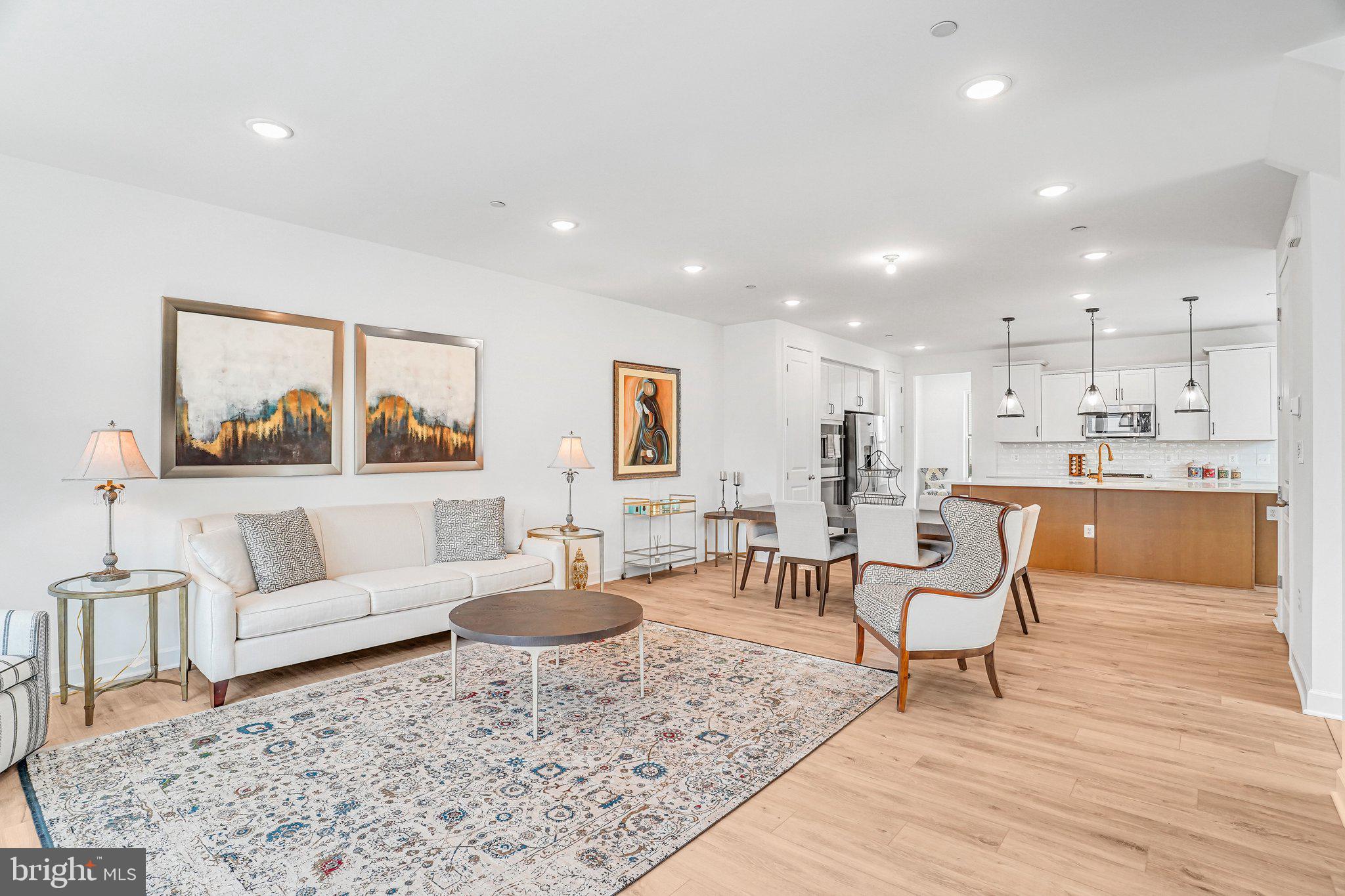 Experience elevated living in this like-new, barely lived-in corner-unit townhome nestled in The Boulevards at Westfields. This sought-after Bennington II model by K. Hovnanian offers 5 spacious bedrooms and 4.5 beautifully appointed bathrooms, thoughtfully designed for both style and functionality.
Perfectly positioned on a premium corner lot, the home is bathed in natural light thanks to additional windows that create a bright, airy ambiance throughout. The heart of the home is a sophisticated gourmet kitchen, featuring high-end appliances, sleek finishes, and a generous center island—ideal for entertaining or casual everyday living. Just off the kitchen, a versatile main-level office or sitting area provides the perfect space for working from home or relaxing.
A sun-drenched sunroom offers a peaceful retreat for morning coffee or unwinding at the end of the day. Step outside to an impressive two-level deck, creating exceptional space for outdoor entertaining and enjoying scenic views.
The top-level loft adds incredible flexibility, featuring a private bedroom, full bathroom, and a comfortable sitting area—ideal for guests, an au pair suite, or multi-generational living.
The corner location enhances both privacy and outdoor living potential, making this home a truly rare and desirable opportunity in a highly sought-after community.