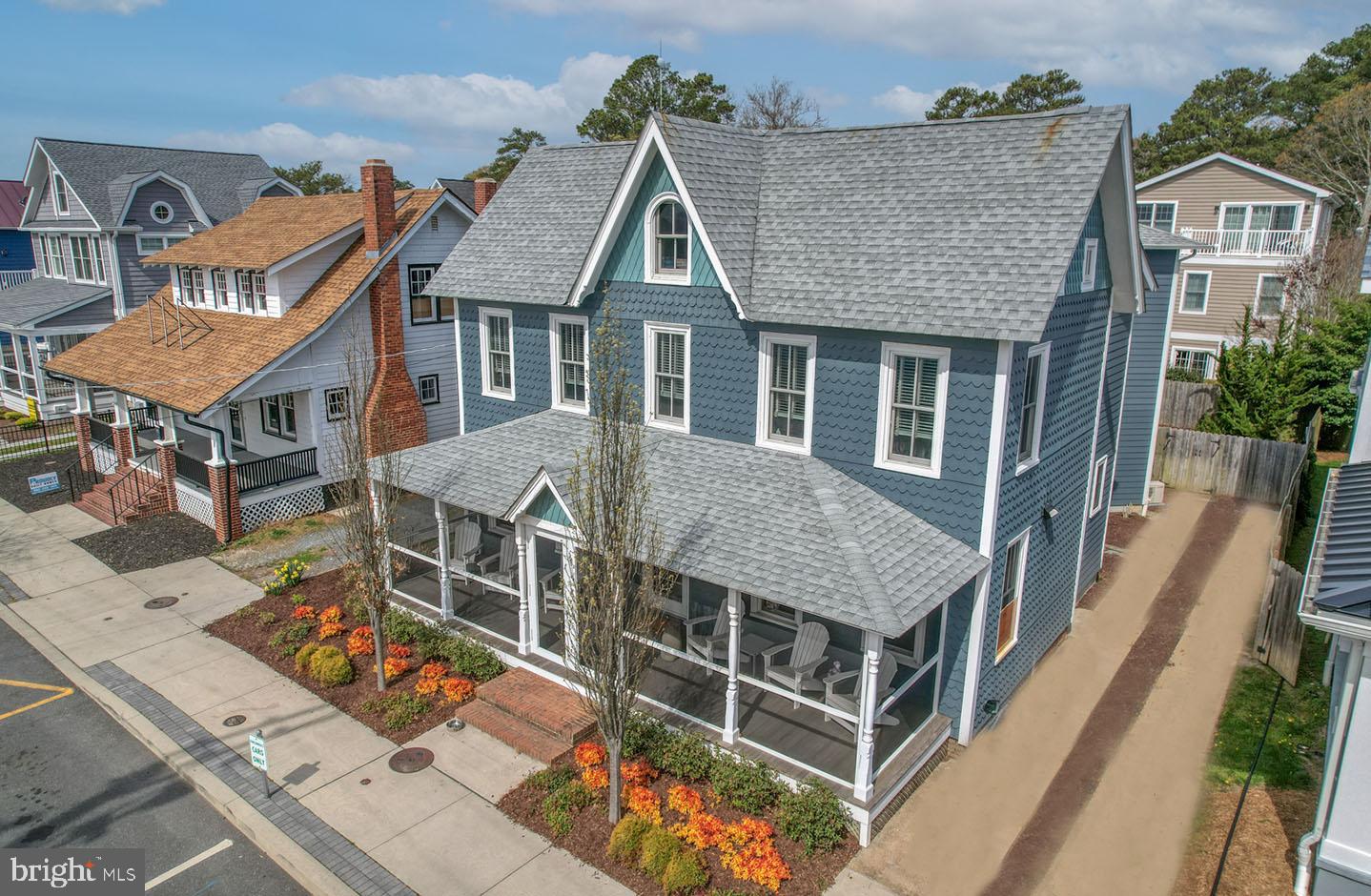 Historic charm and modern-day amenities describe this beautifully appointed 5BR, 4.5BA home on Lake Avenue.  Originally built in the early 1900’s and completely rebuilt in 2015, this North Rehoboth home displays the character of Old Rehoboth but features an open and airy floorplan that is sought after in today’s market!  The welcoming front porch enhances the curb appeal of this home and offers the ideal setting for relaxation on breezy summer evenings!  Upon entry, you will be wowed by the gourmet kitchen with commercial grade stainless appliances, beverage station and the oversized quartz, waterfall island.    The dining area and family rooms are open to the kitchen offering the perfect setting for entertaining!  The family room is flooded with natural light from the oversized windows and adorned with a gas fireplace and coffered ceilings.  The recently added den features ship lapped walls and a separate mini-split system.  This space is a great space for a home office, fitness area, or game room, the options are endless!   Tasteful finishes include hardwoods throughout, quartz counters, tiled baths with frameless glass doors, oversized primary suite with oversized custom closet and en-suite spa bath complete with a jetted soaking tub.  The property also boasts a private rear yard complete with heated pool and paver patio too!  Re-built prior to code changes, this home could not be duplicated by today’s building code!  All of this and a superb “In-Town” location too.  What more could you ask for?