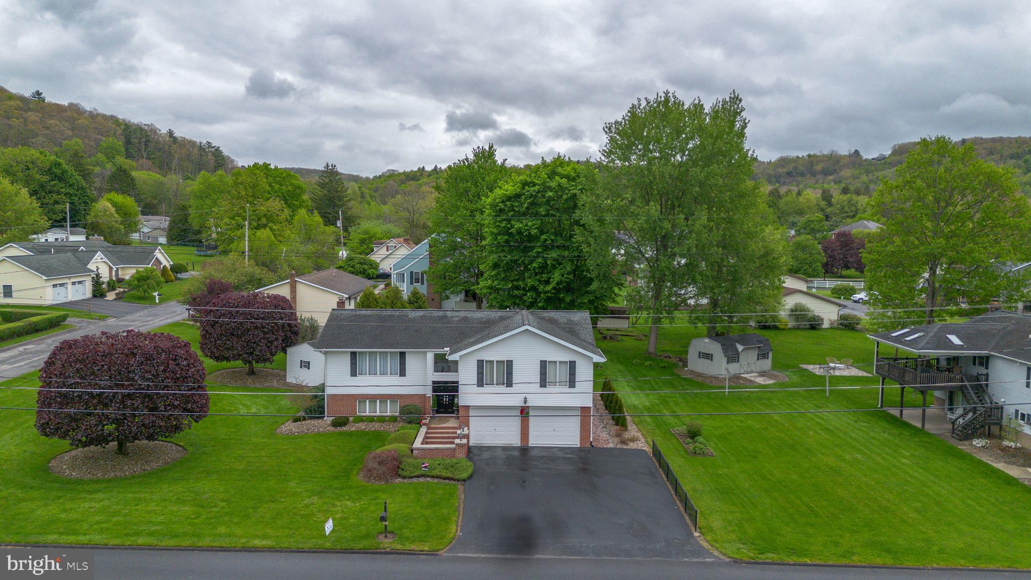 This one-story home features a landscaped front yard and an integral two-car garage. Inside, the main level includes a living room that connects to a formal dining room. The kitchen is equipped with Corian countertops and includes an eating area with direct access to a large back deck. Three bedrooms and one full bathroom are also located on this main floor.

The finished lower level provides additional living space, featuring a large family room centered around a wood-burning fireplace. This lower level also contains a second full bathroom and a dedicated laundry room. Schedule your tour.