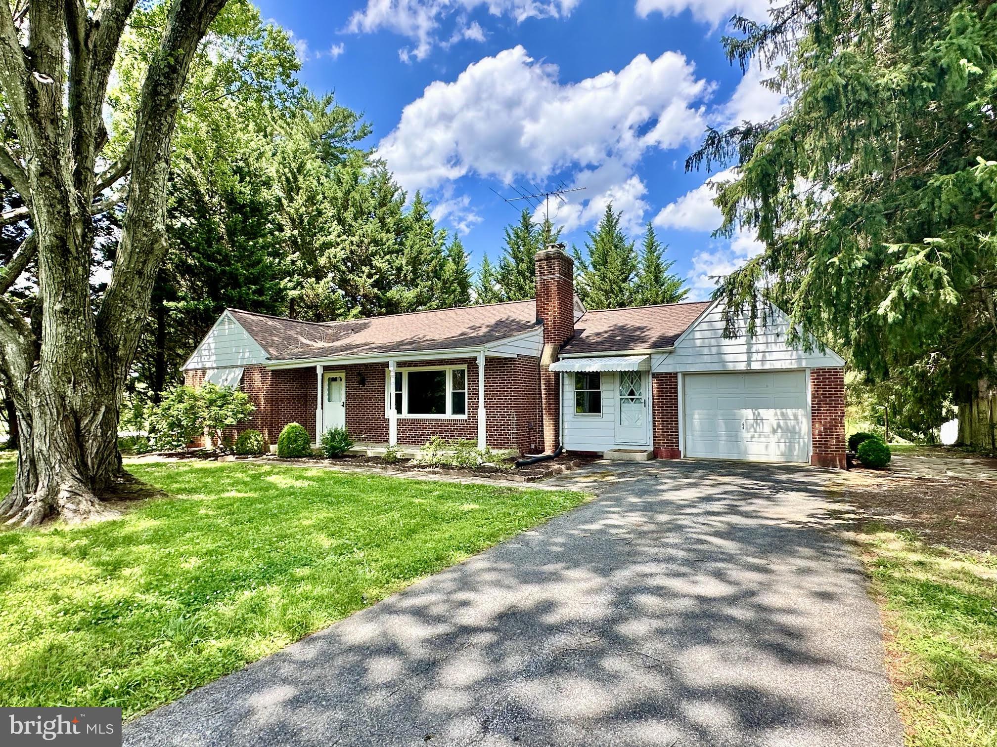 *Opportunity awaits in this solid 3BR rancher located in desirable Southern Finksburg, offering a peaceful country setting that backs to trees while remaining convenient to major commuter routes*Exterior features include a covered front porch, asphalt driveway, attached one-car garage, rear covered porch, concrete patio ideal for entertaining, walkout basement access, & a recently replaced roof*Inside, you'll find a traditional floor plan featuring a spacious living room with a wood-burning brick fireplace, charming oval archways, stained wood trim, replacement vinyl-clad energy-efficient windows, central air conditioning, & original solid hardwood floors throughout much of the main level that are ready to be refinished & restored to their former beauty*New carpet in 2 bedrooms just installed*The dining room offers chair rail molding & hardwood flooring, while the kitchen features maple cabinetry, butcher block countertops, & a very functional layout*The main level also includes three bedrooms with carpet over solid hardwood flooring & a full bath with a soaking tub/shower combination, updated vanity, & ceramic tile flooring*An additional family room provides flexible light filled living space & access to the rear patio/backyard*The lower level offers a finished recreation room, half bath, laundry area, & substantial unfinished storage space with walkout access stairs*Major mechanical components include an oil-fired hot water baseboard heating system, newer well equipment, water treatment components, sump pump, & a Generac generator*This home is being sold in "as-is condition" and priced accordingly and may require some cosmetic updates*With strong bones, a desirable location, & several major system updates already completed, this property presents an excellent opportunity for investors, renovators, or buyers looking to build sweat equity & create their own vision*