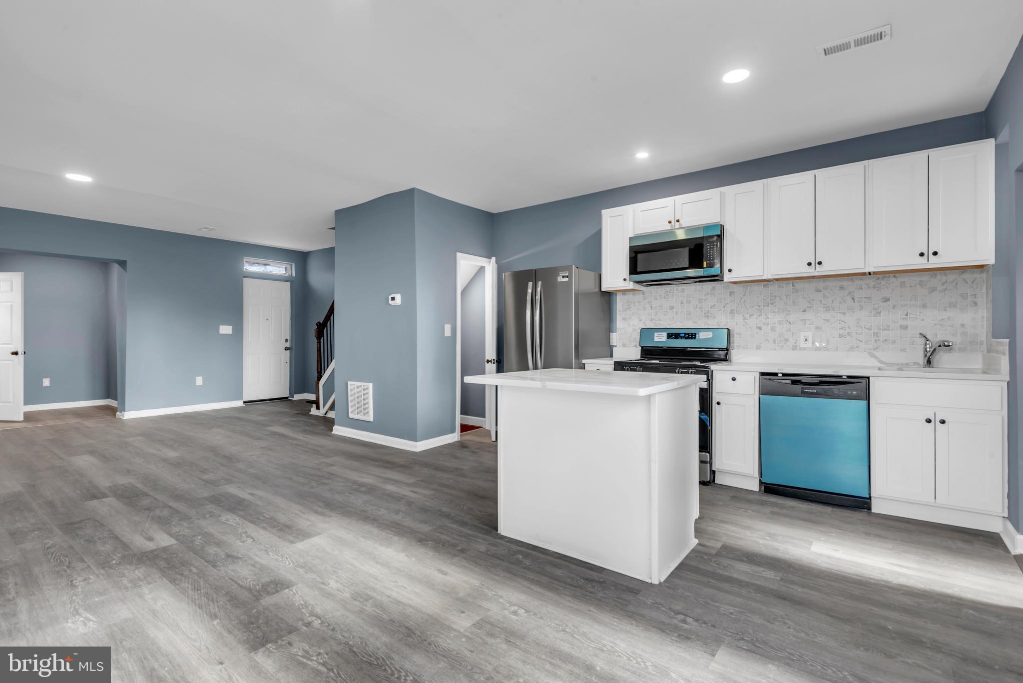 Stunning fully renovated 3BR/1.5BA home loaded with upgrades and natural light. This modern, move-in ready home features an open-concept layout with oversized windows that flood the space with sunlight, luxury vinyl flooring throughout, and elegant hardwood stairs.

The show stopping kitchen is equipped with quartz countertops, stainless steel appliances, a sleek backsplash, and a center island, perfect for entertaining and everyday living. Enjoy added convenience with a main-level powder room and mudroom, plus a partially finished basement offering additional flexible space.

Major updates include ALL NEW systems which include the HVAC, central A/C, water heater, electrical panel, and windows giving you peace of mind for years to come.

This is the one you’ve been waiting for, modern finishes, major upgrades, and incredible value. Schedule your showing today before it’s gone.