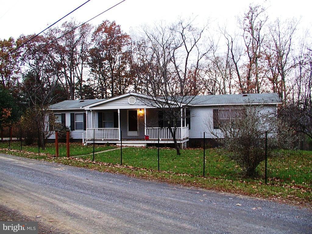 This home is situated on 2 1/2 peaceful acres of serene, flat land with mountain views. It has three large bedrooms with cathedral ceilings & two full bathrooms. The master bath has a garden soaking tub. The home is completely remodeled with fresh paint and new carpets. Enjoy the large front porch and the extra large deck. Call for the low price. wonderful mountain views! All sizes approx