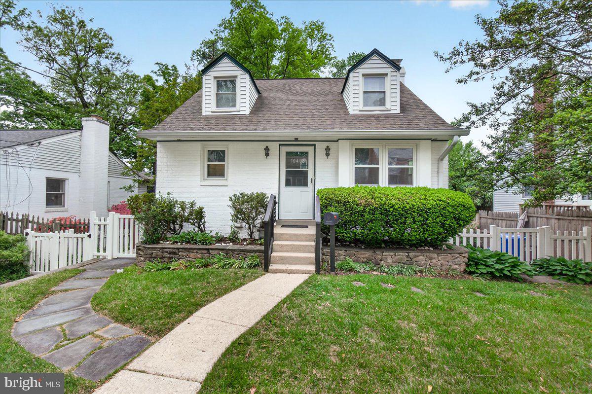 Offer deadline is Tuesday May 5 at 12 pm.
Welcome to this sun-drenched Cape Cod located in this sought-neighborhood in Silver Spring! Step inside the spacious living room that opens seamlessly into the open concept eat-in kitchen, offering a wide-open space perfect for everyday dining and gatherings.
The main level features two comfortable bedrooms and a full bathroom, providing convenient one-level living. Upstairs, you’ll find a loft-style, oversized third bedroom that offers a unique and airy retreat.
The fully finished basement adds exceptional versatility, featuring a large recreation room centered around a beautiful stone-front fireplace. This level also includes a second kitchen with stainless steel appliances, a stylish white tile backsplash, and a full bathroom, making it ideal for multigenerational living, extended stays, or flexible use. With full baths and kitchens on both levels, the home is thoughtfully designed to accommodate a variety of living arrangements.
Step outside to enjoy your own private backyard oasis. A stone patio creates the perfect setting for outdoor dining and entertaining, surrounded by mature trees and beautifully manicured landscaping.
With its flexible layout and multiple living spaces, this Cape Cod is ready to meet the needs of its next owner. Don’t miss out, schedule your private showing today!