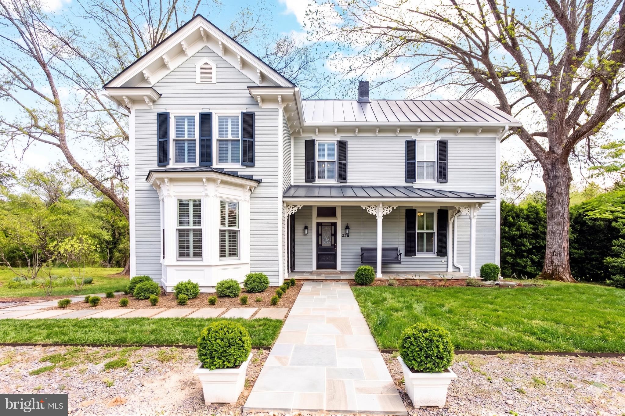 This offering is a true rarity in Washington, VA, as the price includes the primary historic home on 0.74 acres including four adjoining lots with approved site-certified perc's, totaling 9.15 acres. The property includes a $105,000 escrow dedicated to road construction, making this a savvy opportunity for an investor. Also see MLS VARP2002624. Welcome to the formally registered Dudley House at 558 Gay Street, a stunning 1890 late-Victorian estate nestled in the original town surveyed by a 17-year-old George Washington. Situated on land whose title traces back to a 1798 town grant, this architectural gem has just undergone a complete, uncompromising, top-to bottom reconstruction. While the current owner meticulously preserved the home's 19th-century soul, the renovation brought the house up to modern standards of comfort and efficiency. This is a true down-to-the-studs rebirth, the home now features entirely new electrical wiring, ductwork, a new electric water heater, a state-of-the-art two-zone heat pump system, and an all-new metal standing seam roof. The technical integrity of the Dudley House is unparalleled in the historic market. The structure has been bolstered with new attic insulation and high performance aluminum-clad double-hung Marvin windows that offer modern thermal efficiency without sacrificing the home's iconic historic profile. The owner has even pre-installed the infrastructure for a backup generator. Inside, the craftsmanship is felt at every turn, from the beautifully restored original heart pine floors to the spectacular walnut central staircase. The kitchen and bathrooms feature bespoke custom cabinetry as well as locally quarried Virginia Mist granite. The sun-drenched floor plan offers a seamless flow between historic parlors and newly built luxury spaces. The graciously proportioned living room and surrounding covered porch offer panoramic views of the surrounding hills, including Mount Menafee to the northeast. The capacious country kitchen, which also opens onto the back porch, features all new appliances, a large central island, ample storage space, and original glass-front cabinets and a decorative mantlepiece. The dining room, whose bay window overlooks Gay Street, also features a Jeffersonian window and decorative mantlepiece. The front parlor, which features a cozy brick fireplace, connects to a full shower bath, providing the rare flexibility of a main-level bedroom suite. Upstairs, the primary bedroom with views to three sides features a large ensuite bathroom with a claw-foot tub. Two more spacious bedrooms share an expansive double bath featuring a separate toilet room, double sink, walk-in shower and two-sided claw foot tub with mountain views. The second floor also features a laundry room with a new washer/dryer and high-end utility sink, and storage areas. Outside, the 0.74-acre house lot is nothing short of magical. Two majestic, century old pecan trees flank the residence, buttressed by 12-foot-tall antique boxwoods. A professionally designed formal garden surrounds the house, featuring natural stone walls and walkways, a culinary herb and fruit garden, and local native flora. Flowering trees and shrubbery fringe the front yard and the sweeping rear lawn. The magic continues beyond the house lot with an additional 8.41 acres of meadows and woods with mountain and water views. Stroll along the mown paths that edge the four meadows and take in stunning views of the Peak and Mount Menafee, then amble beside the quaint pond and year-round stream that flows through the property. An old apple orchard, blueberry, and raspberry patches offer fresh fruits in season. Located just a short, pleasant stroll from the world-renowned Inn at Little Washington and Patty O's Cafe, you are also only a short drive from Shenandoah National Park. The Dudley House is a masterclass in what happens when you don't cut corners—a legacy estate, masterfully finished, ready for its next hundred-year chapter.