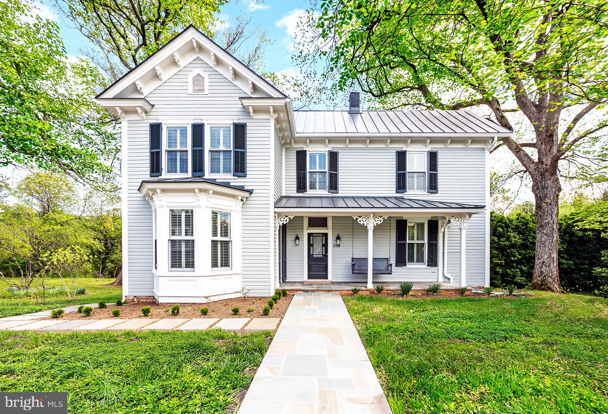 This offering is a true rarity in Washington, VA, as the price includes the primary historic home on 0.74 acres including four adjoining lots with approved site-certified perc's, totaling 9.15 acres. The property includes a $105,000 escrow dedicated to road construction, making this a savvy opportunity for an investor. Also see MLS VARP2002624. Welcome to the formally registered Dudley House at 558 Gay Street, a stunning 1890 late-Victorian estate nestled in the original town surveyed by a 17-year-old George Washington. Situated on land whose title traces back to a 1798 town grant, this architectural gem has just undergone a complete, uncompromising, top-to bottom reconstruction. While the current owner meticulously preserved the home's 19th-century soul, the renovation brought the house up to modern standards of comfort and efficiency. This is a true down-to-the-studs rebirth, the home now features entirely new electrical wiring, ductwork, a new electric water heater, a state-of-the-art two-zone heat pump system, and an all-new metal standing seam roof. The technical integrity of the Dudley House is unparalleled in the historic market. The structure has been bolstered with new attic insulation and high performance aluminum-clad double-hung Marvin windows that offer modern thermal efficiency without sacrificing the home's iconic historic profile. The owner has even pre-installed the infrastructure for a backup generator. Inside, the craftsmanship is felt at every turn, from the beautifully restored original heart pine floors to the spectacular walnut central staircase. The kitchen and bathrooms feature bespoke custom cabinetry as well as locally quarried Virginia Mist granite. The sun-drenched floor plan offers a seamless flow between historic parlors and newly built luxury spaces. The graciously proportioned living room and surrounding covered porch offer panoramic views of the surrounding hills, including Mount Menafee to the northeast. The capacious country kitchen, which also opens onto the back porch, features all new appliances, a large central island, ample storage space, and original glass-front cabinets and a decorative mantlepiece. The dining room, whose bay window overlooks Gay Street, also features a Jeffersonian window and decorative mantlepiece. The front parlor, which features a cozy brick fireplace, connects to a full shower bath, providing the rare flexibility of a main-level bedroom suite. Upstairs, the primary bedroom with views to three sides features a large ensuite bathroom with a claw-foot tub. Two more spacious bedrooms share an expansive double bath featuring a separate toilet room, double sink, walk-in shower and two-sided claw foot tub with mountain views. The second floor also features a laundry room with a new washer/dryer and high-end utility sink, and storage areas. Outside, the 0.74-acre house lot is nothing short of magical. Two majestic, century old pecan trees flank the residence, buttressed by 12-foot-tall antique boxwoods. A professionally designed formal garden surrounds the house, featuring natural stone walls and walkways, a culinary herb and fruit garden, and local native flora. Flowering trees and shrubbery fringe the front yard and the sweeping rear lawn. The magic continues beyond the house lot with an additional 8.41 acres of meadows and woods with mountain and water views. Stroll along the mown paths that edge the four meadows and take in stunning views of the Peak and Mount Menafee, then amble beside the quaint pond and year-round stream that flows through the property. An old apple orchard, blueberry, and raspberry patches offer fresh fruits in season. Located just a short, pleasant stroll from the world-renowned Inn at Little Washington and Patty O's Cafe, you are also only a short drive from Shenandoah National Park. The Dudley House is a masterclass in what happens when you don't cut corners—a legacy estate, masterfully finished, ready for its next hundred-year chapter.