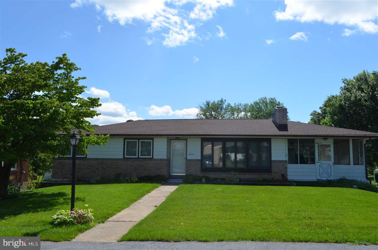 Move right in this fabulous ranch home with updated kitchen and baths. Home features lots of hardwood flooring, spacious living room w/ fireplace, 3 bedrooms, 1   baths, and possible 4th bedroom in finished walk out lower level. Relax in sunroom or spend time in the large back yard.  Plus replacement windows, newer roof, furnace, central air and storage shed. View today!