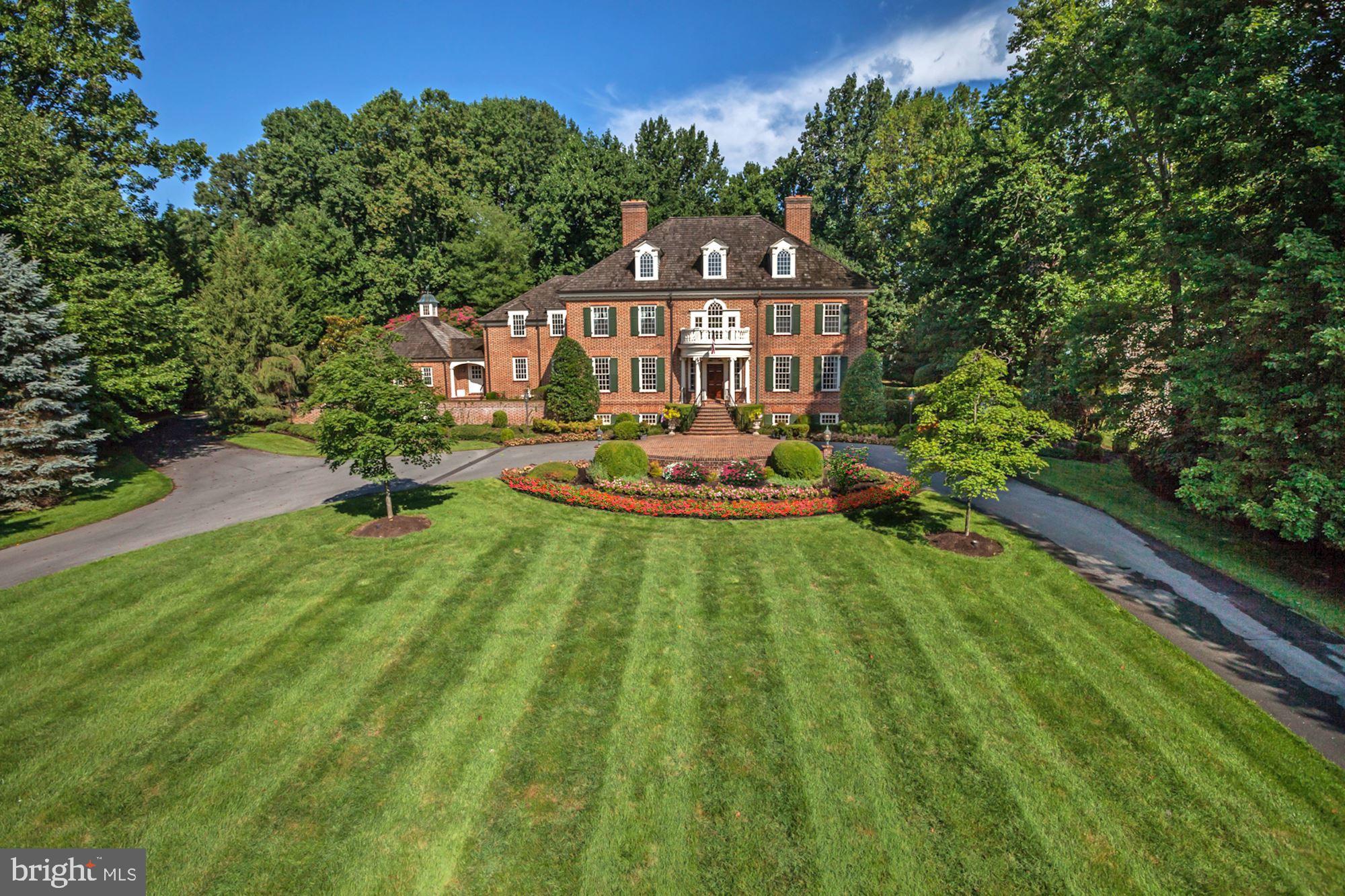 PRICE REDUCED!  This is one of the only custom designed and built homes on Country Club Drive.  It's 30% larger than most, with a beautiful center gallery and 3rd floor.  The custom millwork, finishes, Flemish bond brick design, newly renovated interior, European gardens, flat/private backyard and exquisite architectural detail truly set it apart.  Must see to appreciate.