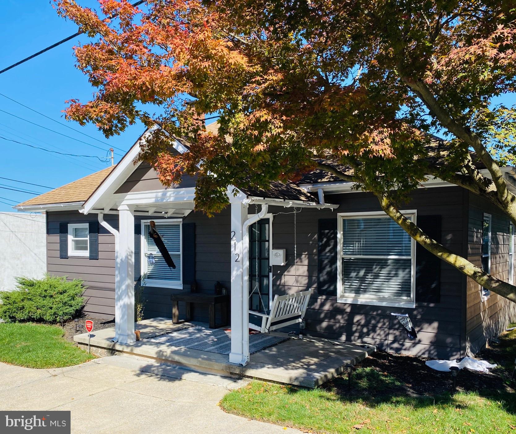 Charming home with a delightful front porch , small private rear yard with a new wooden fence,  nice landscaping, and a detached one car garage. This quaint house has maintenance free vinyl plank floors throughout, classic white kitchen with soft close drawers and doors, microwave, dishwasher, and gas stove.
