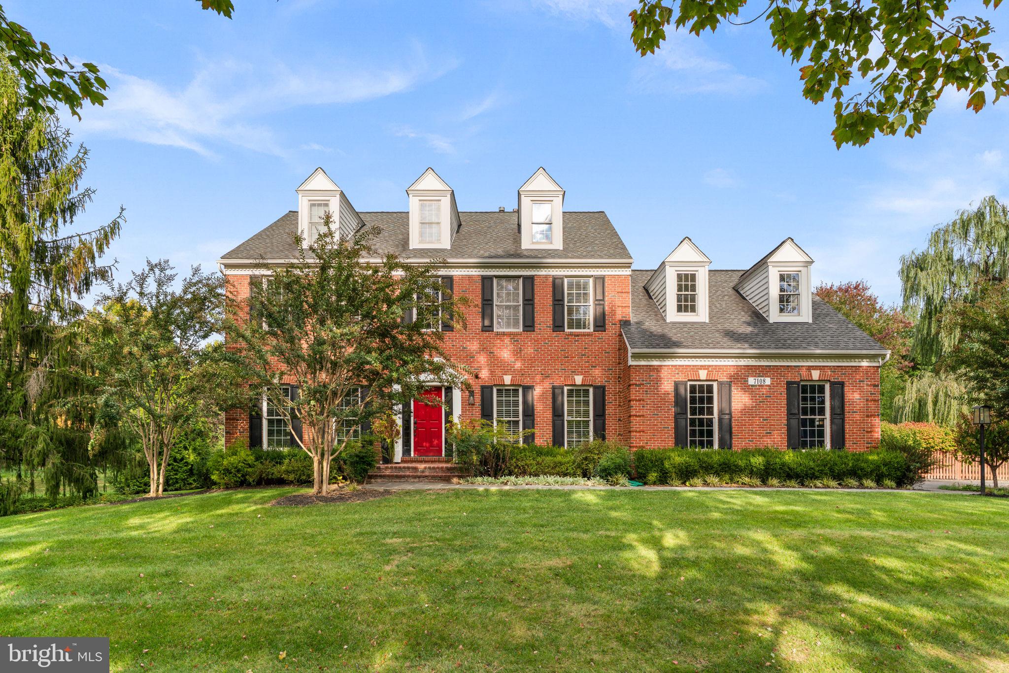 Stunning Interior | Exceptional Rear Yard | Modern Finishes | Welcome to 7108 Carlisle Court, a stately brick-front colonial tucked away on a picturesque homesite in the coveted Ashleigh Knolls community of Clarksville. Known for its generous lot sizes, beautifully maintained homes, private community walking paths, tennis and pickleball courts, and exceptional curb appeal throughout, Ashleigh Knolls remains one of Howard County’s most sought-after neighborhoods year after year. From the moment you arrive, the pride of ownership is unmistakable. Mature and diverse landscaping frames the bold, stately exterior, creating a grand first impression. The fenced backyard is equally impressive; a private outdoor retreat featuring an expansive open lawn with swing set, storage shed, composite deck, flagstone patio with permanent fire pit, and plenty of room to entertain, play, or simply unwind. The timeless Howard County colonial floor plan has never gone out of style, offering generous ceiling heights across all three levels, a dramatic two-story foyer, private home office, vaulted ceilings, crown molding, abundant natural light, and beautifully maintained move-in-ready spaces throughout. The updated gourmet kitchen serves as the heart of the home, seamlessly connecting to the main living areas and creating the perfect environment for everyday living and entertaining. Upstairs, you'll find four spacious bedrooms and three full bathrooms, including a beautifully renovated primary suite bath completed in 2024. The fully finished lower level offers exceptional flexibility with a large recreation area, bar, media room, home gym space, and abundant room for hobbies, games, or gatherings. With its expansive footprint and full bathroom, the lower level also presents excellent multi-generational living potential or space for extended guests. This home checks every box for today’s buyer seeking modern finishes, functional living spaces, and turnkey condition. Major updates include an architectural shingle roof (2014), HVAC system (2013), composite deck (2015), stone patio and walkways (2016), additional ensuite bathroom (2016), replacement windows, fully renovated primary bath (2024), new front door (2025), water heater (2025), dishwasher (2025), fresh interior paint (2026), new carpet (2026), and professional landscaping maintained annually. Situated just minutes from River Hill Village Center, Maple Lawn, and some of Howard County’s most desirable shopping, dining, residents enjoy easy access to Routes 32, 29, and I-70, making commutes to Baltimore, Washington D.C., Columbia, and Fort Meade exceptionally convenient. The home is also located within the highly regarded Howard County Public School System and serves the acclaimed Atholton High School district. 7108 Carlisle Court represents the perfect blend of timeless architecture, thoughtful updates, exceptional outdoor living, and an unbeatable Clarksville location. A rare opportunity to own a truly exceptional home in one of Howard County’s premier communities.