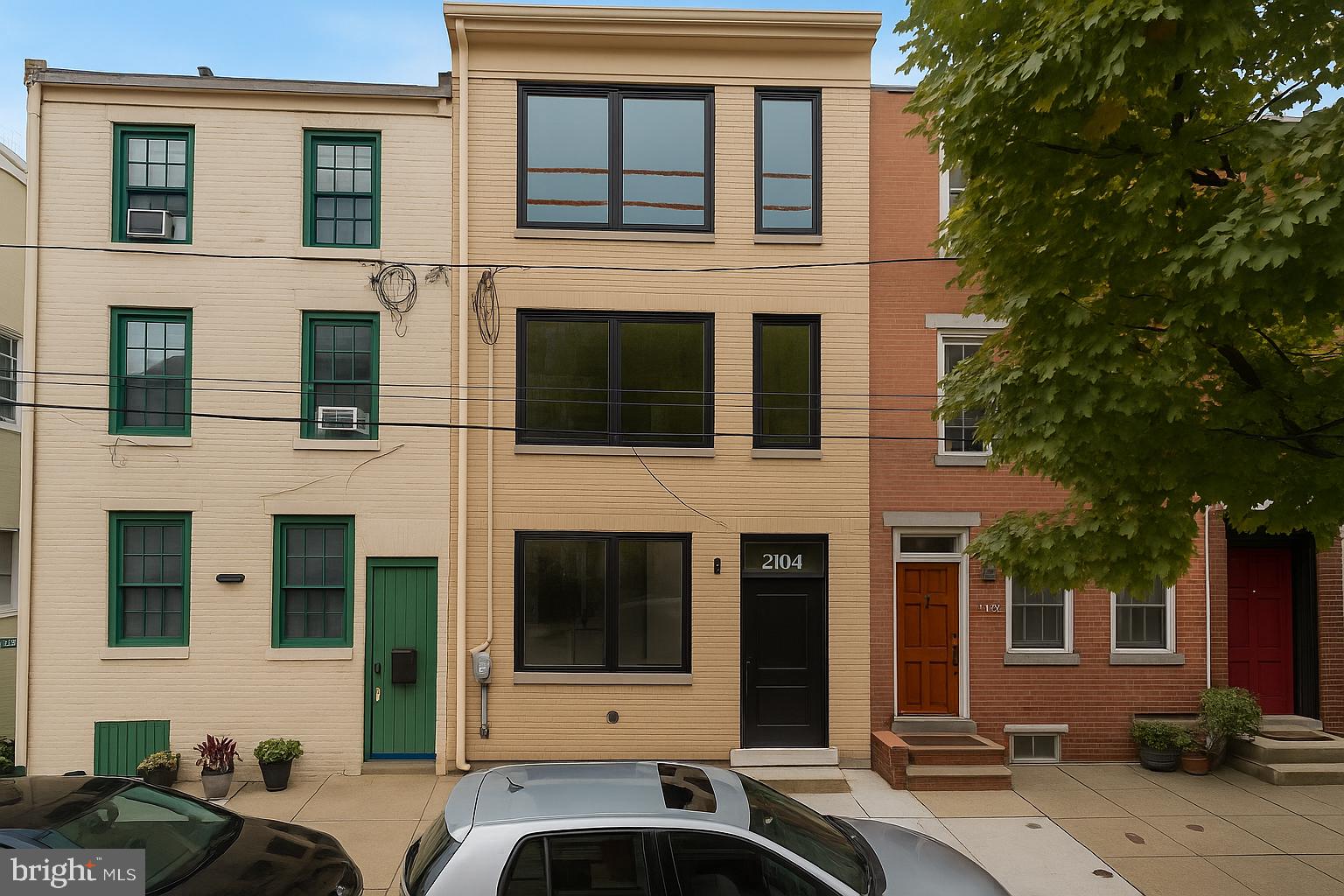 4.875% Fixed Interest Rate for 5 Years / 5% Fixed Rate for 7 Years Available with Preferred Lender — Limited-Time Rate Buydown Offer for Qualified Borrowers.

A rare opportunity to own ground-up new construction in the heart of Fitler Square, within the highly coveted Albert M. Greenfield School catchment and tucked along one of Rittenhouse’s most prestigious blocks, Naudain Street. Designed by LTD Design, this 4-bedroom, 4.5-bath luxury residence offers DEEDED PARKING and approximately 2,600 square feet of impeccably crafted living space, seamlessly blending modern design with timeless sophistication.

The main level features an open, light-filled floor plan with wide-plank white oak floors and an elegant living area that flows directly into the dining space and chef’s kitchen. Designed for both style and function, the kitchen is finished with custom two-tone cabinetry, veined quartz countertops and backsplash, Thermador appliances, and an oversized waterfall island. Glass doors open to the private backyard, creating a natural extension of the living space—ideal for outdoor dining and entertaining.

The second floor offers two spacious bedrooms, a full bath, and a conveniently located laundry room. The third floor is dedicated to the primary suite—a tranquil retreat with a grand custom walk-through closet and a spa-like bath featuring dual vanities, heated floors, a freestanding soaking tub, a frameless glass shower with rain head and body sprays, and a Neorest bidet toilet.

The fourth level encompasses a full-floor flex space with a full bath and wet bar—perfect for a home office, guest suite, or den—along with access to a two-level roof deck. A double sliding patio door opens to the lower deck, outfitted with stone pavers and picturesque skyline views. The upper deck offers an expansive entertaining area with sweeping views of the city.

Additional highlights include dual-zone HVAC, a 1-year builder’s warranty, and a 10-year tax abatement for long-term savings. Just steps from Fitler Square Park, the Schuylkill River Trail, and some of the city’s best restaurants and cafés, this home delivers modern luxury and urban convenience in one of Philadelphia’s most sought-after neighborhoods. Estimated delivery 3 months from the time of an executed contract. The list price includes one driveway parking space, with an additional space available for purchase.