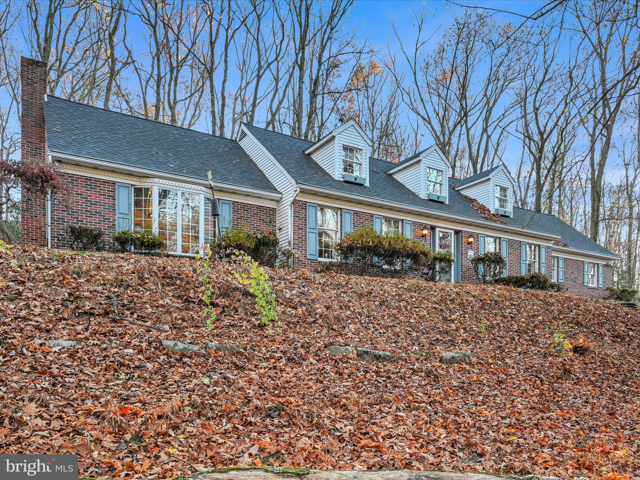 Back on the market due to out of state buyer not being able to sell their home. Home was appraised with no repairs requested or required. Welcome to this lovingly built and maintained home. Many features were considered for their forever home, for one floor living when needed. If you're looking for privacy and peaceful surroundings, look no more. The abundance of nature will surround you. Cozy up in the sunken Family Room by the propane fireplace or 3 seasons Sun Room and observe the deer and birds. A highly functional Eat-In Kitchen with a double sink and plenty of cabinets and Corian Countertop space. Half doors were installed to corral pets and a pocket door was chosen for the Living Room. This was to become a main floor bedroom, directly across from a full bath with a stall shower. A large Dining Room, Office and Laundry Room complete the main floor. The upper level consists of 2 matching bookend Bedrooms, a Full Bath and Walk-In Cedar closet. A built-in security system alerts you when someone enters the driveway or the home, with police, fire and rescue at the ready.