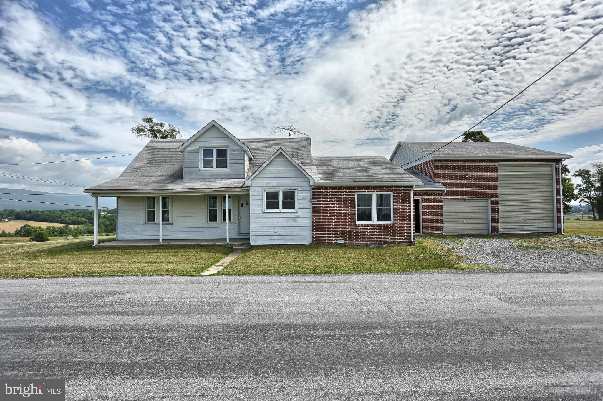 Beautiful Cape Cod is located on .95 acre and features 2 bedrooms, 1 bathroom, large family room, living room, foyer room, eat in kitchen, a partially finished attic, and additional storage in the attic. The basement is finished and has a kitchen along with a fireplace. This home features a large breezeway leading to the large 3 plus car garage with a very high ceiling.