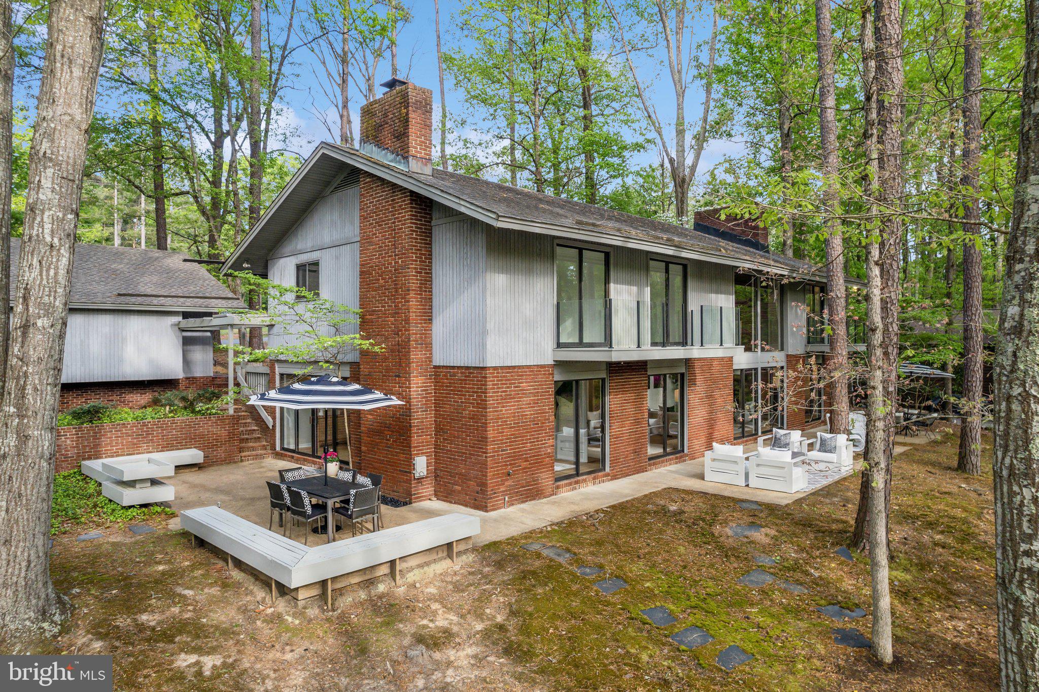 Rare Contemporary Lakeside Retreat on Lake Cherokee – 4460 Cheyenne Road, Richmond, VA

Discover a truly one-of-a-kind contemporary home tucked away on a private, oversized lot on serene Lake Cherokee—just off the James River on Richmond’s Southside. Thoughtfully designed and custom-built by a commercial glass contractor, this architectural gem maximizes natural light and panoramic lake views with its massive rear-facing windows and sleek glass balcony panels.

Step inside to a stunning two-story family room anchored by a dramatic brick fireplace and accented by a second cozy fireplace—perfect for entertaining or relaxing with family. Recent upgrades include new luxury vinyl plank flooring, plush carpet and pads, fresh interior paint, and designer touches throughout.

The kitchen is a chef’s delight with granite countertops, rich maple cabinetry, and upgraded stainless appliances. Custom bathroom vanities with quartz countertops elevate the home’s modern aesthetic. The home also features a 2-car garage plus a separate workshop—ideal for hobbyists or extra storage.

Step outside and enjoy your own slice of lakeside paradise with a brand-new dock, a healthy fishing pond, and postcard-worthy views from every angle. Whether you're enjoying sunrise coffee or evening sunsets, the waterfront lifestyle here is unmatched.

Professionally staged by JSquared—all furniture is available for purchase with the home.