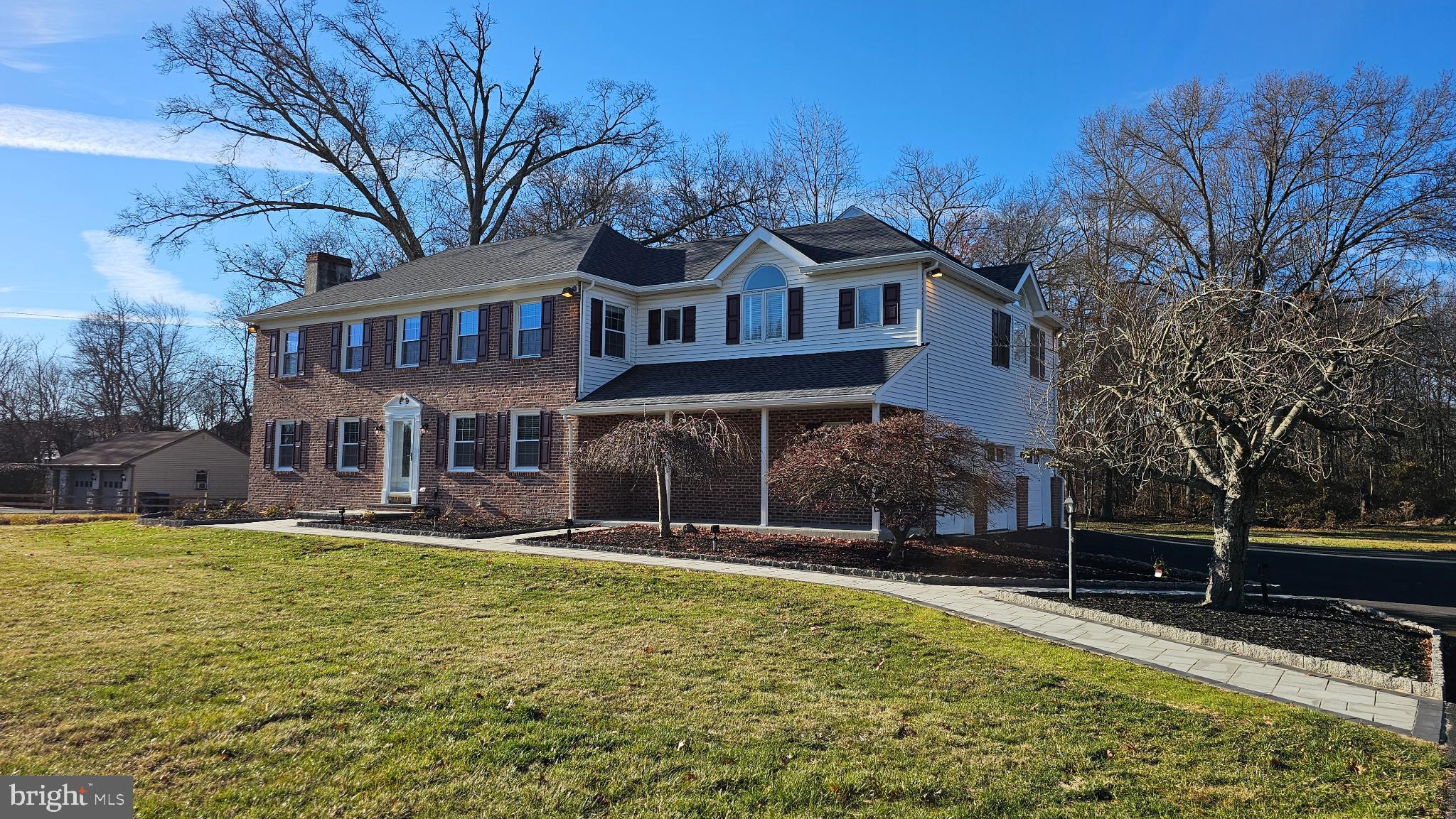 Discover a stunning Colonial-style residence that seamlessly blends classic charm with modern luxury. This meticulously maintained home, set to, boasts an impressive 3,873 sq. ft. of living space, perfect for entertaining and everyday comfort. Step inside to find exquisite interior features, including gleaming hardwood floors, crown moldings, and a traditional floor plan that invites warmth and connection. The gourmet kitchen is a chef's dream, equipped with stainless steel appliances, an island for casual dining, and upgraded countertops that elevate your culinary experience. Enjoy cozy evenings by the fireplace with glass doors, or unwind in the luxurious bathroom featuring a jetted tub and walk-in shower. The fully finished, heated basement offers endless possibilities for recreation or relaxation, while the upper floor laundry adds convenience to your daily routine. With ample storage throughout, including walk-in closets and a wet/dry bar, this home is designed for modern living. Nestled on a sprawling 1.92-acre lot, the property is a private oasis, bordered by trees and featuring a serene stream. The outdoor space is perfect for gatherings or quiet moments in nature, complemented by a charming gazebo. With a detached garage accommodating three vehicles and additional driveway space for 14, parking is never a concern. This exceptional property is not just a home; it's a lifestyle waiting to be embraced. Don't miss your chance to make it yours!