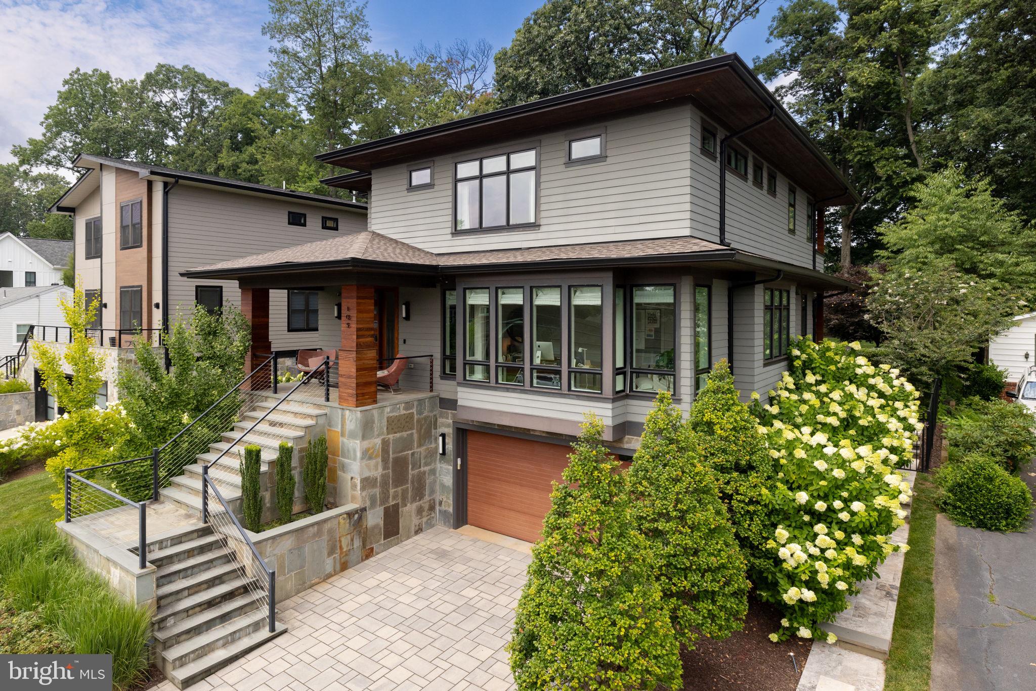 ***Offer deadline set for Tuesday, February 20 at 7pm***

Welcome to this stunning modern bungalow built in 2016 in the heart of Vienna, VA. This architectural masterpiece with over $400,000 in luxury upgrades is an exceptional offering and truly move-in ready.

A lovely manicured yard with lush trees and tall grass welcomes you to this contemporary home with cable railings, HardiePlank lap siding, wood, and bluestone accents.  The open-concept layout features 9-foot ceilings, hickory plank hardwoods, and oversized casement windows.

The main level boasts a light-filled home office with beautiful glass/steel privacy doors and custom woodwork, as well as an extended foyer with a convenient powder room and mudroom with built-in storage.  An inviting family room with a wood-burning fireplace is perfectly positioned and open to the kitchen, it provides easy access to the covered porch and large patio.

A top-of-the-line chef’s kitchen is the center of this home. It boasts stainless steel professional appliances (Wolf 60” six-burner gas stove with double ovens and 48” Subzero Pro glass door refrigerator), a showpiece Quartz island and countertops with a hand-glazed backsplash, a pantry storage room and a separate dining area.

Upstairs, you'll find a primary suite with two additional en-suite bathrooms/bedrooms, an upper-level flex space (perfect for an additional home office), and a laundry room with an ample amount of storage space.. The owner's suite offers a double-entry walk-in closet and spa-inspired bathroom with an oversized floor-to-ceiling shower.

The lower level features a guest suite, a home gym and spa with an infrared sauna and cold plunge tank (can be purchased separately), a utility room with a multi-purpose shower (perfect for dogs) and a dream garage with professionally epoxied flooring and a dedicated Tesla charger.

Seamlessly blend indoor/outdoor living and entertain in style on this large covered porch with an expansive step-down patio and a built-in Wolf outdoor grill. Perfect for a big crowd or an intimate gathering, the backyard features extensive hardscaping, outdoor lighting, an irrigation system and a large grassy area.

The neighborhood is ideally positioned in the Town of Vienna, minutes from Church Street, Whole Foods Market and the W&OD Trail. Close to the Vienna Metro Station, I-66, and Tysons.  Located in the sought after Madison High School Pyramid. Don’t miss your chance to experience modern living at its finest.