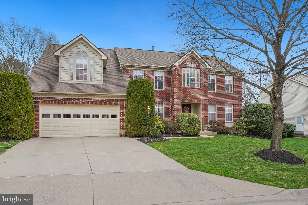 Lovingly cared for by its original owners, this center hall colonial radiates warmth, comfort, and an undeniable sense of home. The house has a stately front brick facade, elegant circle-top windows, a two-car garage, and is professionally landscaped. Entering the home, find yourself in the two-story foyer with hardwood flooring. A convenient coat closet is along the hall. Off to the right is the living room, which has four windows, and access to the office. The formal dining room has two front yard facing windows and connects to the kitchen and breakfast area.  Enjoy the deck and backyard views through the breakfast nook’s big bay window. A convenient desk is built into the kitchen.  Granite countertops stretch around the room, and the center island has a matching granite countertop and built-in gas stovetop. There is also a tile backsplash, double oven and pantry closet.  Just off the kitchen on this main level is garage access, and the mudroom/laundry room which has outside access. There is also a half bathroom on the main level. An expansive family room features a floor to ceiling gas fireplace with brick surround, a cathedral ceiling with two skylights, and a set of French doors that open to the exterior Trex deck with steps leading down the backyard. Upstairs, the spacious primary suite has high vaulted ceilings and a skylight, a sitting area, a vanity area, a sizeable walk-in closet, and a large bathroom. This bathroom features an inviting soaking tub, a walk-in shower, and a vanity area with a skylight.  The hall bath has a tub/shower and a linen closet. There are three additional bedrooms upstairs. This house has a walk-out basement. You’ll find it in the recreation room downstairs, with recessed lights and a sliding glass door to the backyard. A hallway leads down to the full bathroom on this level. There’s also a huge storage room with utilities, various workspaces, and built in shelving.  Newer carpet is throughout the house, and a new floor is in the kitchen area. Other recent improvements include a double oven and a new garage door. The attached two-car garage has built-in shelves and ensures everything has its place. Sited on a quiet cul-de-sac in the sought after neighborhood of Quince Haven, this property is just minutes to major highways, parks like Seneca Creek State Park, and shopping and restaurants in the Kentlands. Don’t miss this opportunity to make this home your very own!