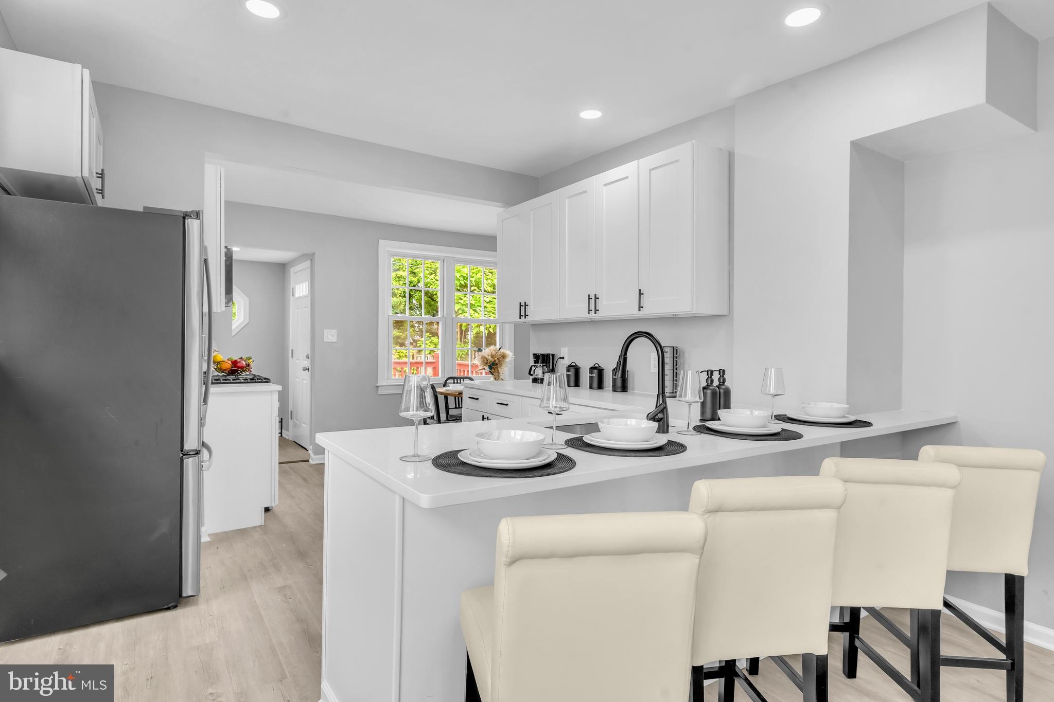 Step into this beautifully renovated 4-bedroom, 2.5-bath Cape Cod style home that perfectly blends classic charm with modern comfort. Featuring an open floor plan filled with natural light, this home is designed for relaxation, comfort, functionality and entertaining. The main level offers two spacious bedrooms, gleaming hardwood floors throughout, and a bright living area that flows seamlessly into the dining and kitchen spaces. The kitchen boasts stainless steel appliances, ample counter space, and a cozy eating area with direct access to the backyard—ideal for outdoor gatherings. Upstairs, you’ll find two additional bedrooms and a full bath, providing plenty of space for family or guests. With updated finishes, stylish bathrooms, and thoughtful design touches throughout, this home is move-in ready. Outside, enjoy a generous front and backyard, complete with a deck perfect for entertaining, gardening, or simply relaxing in your own private retreat. Nestled in a quiet neighborhood, this move-in ready home offers timeless Cape Cod character with all the benefits of a modern renovation.