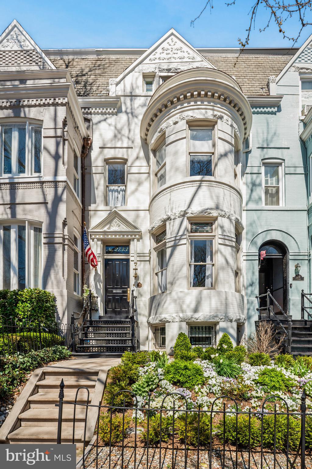 2733 P Street is Georgetown at its best. This home features a stunning interior renovation by Thomson and Cooke Architects using the scale, natural light, historic details and innate elegance of this Victorian home to transform it into a modern masterpiece for today's lifestyle. The main level has beautiful living and dining spaces each fitted with gas fireplaces, large windows, and just enough definition as it flows from room to room. In the rear of the home is the chef's kitchen with an additional walk-in pantry. The kitchen features custom inset cabinetry, Subzero and Wolf appliances and all new windows and doors leading to the rear patio/garden. The reimagined exterior space features beautiful pavers, a built-in grill, outdoor TV and plenty of space for lounging and dining. The upper level has three bedrooms and two full bathrooms as well as additional storage and laundry. The second upper level showcases a large primary suite with two walk in closets, a luxurious bath with shower and tub, a south-facing balcony, and something you rarely find in Georgetown - a roof deck! The lower level makes for great bonus space as a rec room or an additional bedroom with option for a full bath. There is a second laundry area and also en exterior entrance. This property manages to capture the true Georgetown feel without sacrificing on any modern amenities. All sq. ft. is approximate.