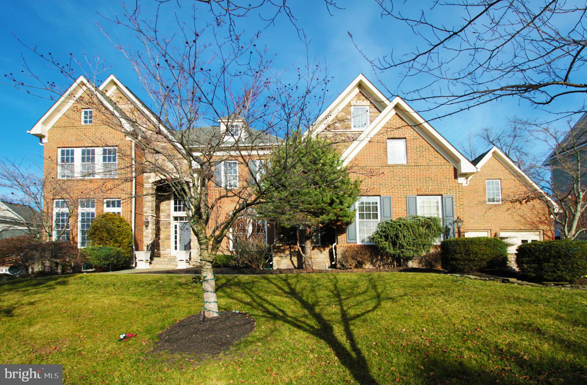 Welcome to this magnificent  Lansdowne estate with exquisite architecture and luxury living come together with rare available FOUR CAR GARAGE.  Boasting with every optional extension with over 9,000 sq ft, this residence offers an unparalleled level of comfort and sophistications in luxury living.  The enormous open floor plan  with 10 foot high ceilings and endless windows with abundant natural lights is ideal for large gatherings.  Our reception starts with  a  stunning 2 story foyer with an elegant curved staircases with wrought iron railing details. The elegant center hall  and  an oversized formal dinning room are ready for entertaining,  A well appointed formal library is  ideal for private meetings. The timeless interior features continue on the main level with gorgeous Exotic Brazilian hardwoods and 10 foot ceilings throughout.  Next comes the  elegant living room with Juliet Balcony access and the grand family room featuring floor to ceiling windows and gas fireplace. A large breakfast room is in adjacent to the rear sunroom with panoramic windows and french doors with transom accessing the large deck.  Opening to the grand family room is the Chef's gourmet  kitchen with  top-of-the-line Wolf 42" PRO Island Hood over the grand center island with contrast cabinetry and pendant lighting in addition to the rich cherry cabinets, a Butler's pantry, High-End SS Appliances, planning desk with organizers.  This home comes with   TWO HUGE OWNER'S SUITES, one on main level with  a grand sitting room facing the wooded back yard that gives you beautiful breathtaking seasonal views.  Ascending to the upper level  from the elegantly curved staircase is the luxury 2nd owner's suite that is huge  and with tray ceilings and large separate sitting area.  The sumptuous owners bath and soaking tub is enormous to enjoy.  Two additional large ensuite bedrooms complete the top floor living.  Coming to the lower level is the enormous walk-up finished  basement with two large recreational  areas. It is perfect for relaxation and entertaining large group of guests for billiards, games while enjoying at the fully equipped wet bar includes wine racks., dishwasher and sink. Workout in the second den/gym,  There are additional finished rooms to turn into medium room,  craft room in addition to an huge  AuPair /guest suite and full bath . Three additional huge unfinished areas provide you more spaces for storage. Lists of recent years upgrades includes: Front Loading Washer & Dryer(2018), Main level Owner's Suite and entire upper level carpet with upgraded padding(2019) Uppwer Level HVAC Unit Carrier iCormfort thermsdat (2019) Gas Water Heater(2021) All 4 Garage Doors(2016)
Outside,  this residence boasts  exceptional architecture design  of a spacious motor court and driveway, stately lighted brick entrance pillars.  A large maintenance free trex deck with stairs to huge lower level custom stone patio surrounded by the stunning outdoor oasis with an outdoor built in fire pit and outdoor lighting for entertaining and luxurious retreat.  Oh there is also the outdoor sprinkler system  for your beautiful  lawn care.  This place is a true gem for stylish and peaceful living.
Community members enjoy access to the Potomac Club which offers indoor/outdoor pools, tennis, billiards and event planning spaces for parties and entertainment. Landsdowne Resort offers golf memberships on 3 courses.  Historic Leesburg and Leesburg Premium outlet is only minutes away.