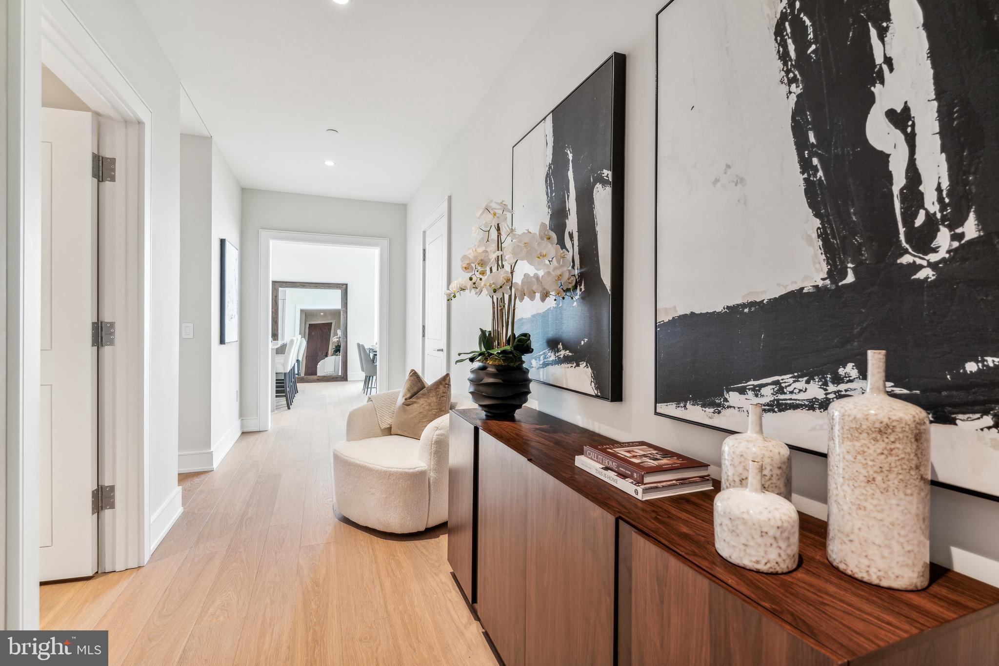 Arthaus, a commanding new residential high-rise in Philadelphia’s performing arts district, presents Unit 2502:  A stunning 2-bed, 2.5 bath, 1,817 SF single-level residence with midtown views priced at $1,655,00.  

This maintenance-free, move-in ready, home offers high-end interior design, resort amenities and white gloves services.  Tax abatement is available.  Whether you’re a busy professional, retiree or globe trotter, 2502 is a MUST SEE!

Arthaus impresses from the moment you enter.  The tall solid wood door with elegant hardware sets the stage, leading to a spacious, light-filled foyer with the large coat closet and convenient hallway bath and laundry room facilities.  The great room offers views of the city featuring a blended kitchen, living and dining space with soaring ceilings, floor to ceiling windows, wide-plank Havwood flooring and a weather-protected walk out balcony. Drenched in natural light this space is bright, airy, and feels twice its size on paper.

The chef’s kitchen is everything you need for hosting, with a large center island that seats four.  The two tone kitchen cabinetry by Poggenpohl are polar white and the countertops Golden Gate quartz with matching backsplash. The high-end, stainless appliance package includes: Wolf, Bosch, Sub-Zero and Asko appliances and door fronts have been fully integrated into the cabinet design for a seamless look.

The primary suite and guest bedroom are on the East side of the condominium.   
The guest bedroom is a quiet retreat for visiting guests with gorgeous midtown views and walk-in closet. The full bath in the hallway is finished with porcelain Calacatta tile floors, super white quartz countertops, and polar white matte Poggenpohl cabinets. The spacious Owner’s suite is wrapped in 10' floor-to-ceiling windows and features two step-in closets. A Badeloft soak-in tub, double vanity with Robern mirrors and super white quartz marble, Contempo white marble floors and shower tile, and a Kohler toilet closet complete the best-in-class bathroom package. 

Arthaus is a modern masterpiece crafted by renowned developer Carl Dranoff, designed by Kohn Pedersen Fox and built by Intech Construction.  Its architecture and amenities prioritize wellness and well-being, from the stunning Monet-inspired mosaic in the lobby to the private resort on the 6th and 7th floors, featuring a pool, fitness facilities, spa, salon, pet park, outdoor terraces, lawns, gardens and more.  White glove services include 24-doorman, concierge, chauffeured town car and car valet. 

This home comes with 1 parking license. With the tax abatement annual real estate taxes are approximately $3,443.