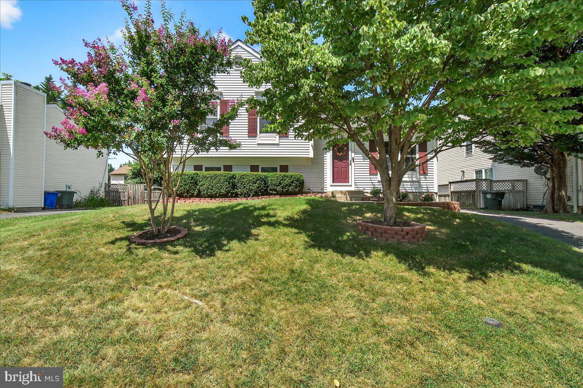 Welcome to this beautifully updated four-level split home, meticulously maintained (updated hot water, heater, HVAC, and windows) by its current owners for over 38 years!  Step inside to gleaming hardwood floors that flow through the living room, dining room, and a tastefully renovated kitchen featuring upgraded countertops. From the dining room, walk out through sliding glass doors onto an oversized deck—perfect for entertaining. Enjoy the spacious, flat, fenced backyard where kids can play safely, complete with two sheds for all your yard and garden tools.
Upstairs, you’ll find the first primary bedroom, along with two additional bedrooms and an updated full bathroom. The third level boasts abundant natural light, a cozy family room, and a second primary suite with its own full bath, closet, and a walkout to the backyard—ideal for guests or multigenerational living.
The unfinished lower level offers a laundry area and plenty of storage space, or the opportunity to finish and add more living square footage to suit your needs.  Conveniently located near shopping, dining, public transit, and major commuter routes. Enjoy the many nearby walking trails and easy access to Baker Park via a pedestrian tunnel under Route 15.  Don't miss your chance to make this exceptional property your new home!