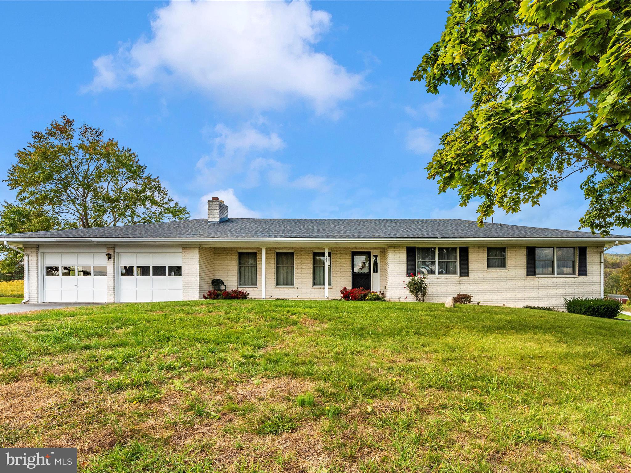 THE MOST AMAZING VIEWS that Middletown has to offer! This lovely, All-Brick Middletown Rancher is situated on 1.17 Acres.  The home features 4 bedrooms and 2 full bathrooms. There are hardwood floors throughout much of the home and there is no carpet! Enjoy the view from the covered front porch or any window.  There is plenty of parking with the 2 car garage and paved driveway. This home has been lovingly cared for and is waiting for you to make it your own! Historic Main Street Middletown is minutes away, which offers fabulous dining & shopping! Lovely Parks, Historic Sites and the Appalachian Trail are nearby. Great commuter location with easy access to I-70. One Year Cinch Home Warranty! Schedule a showing today!