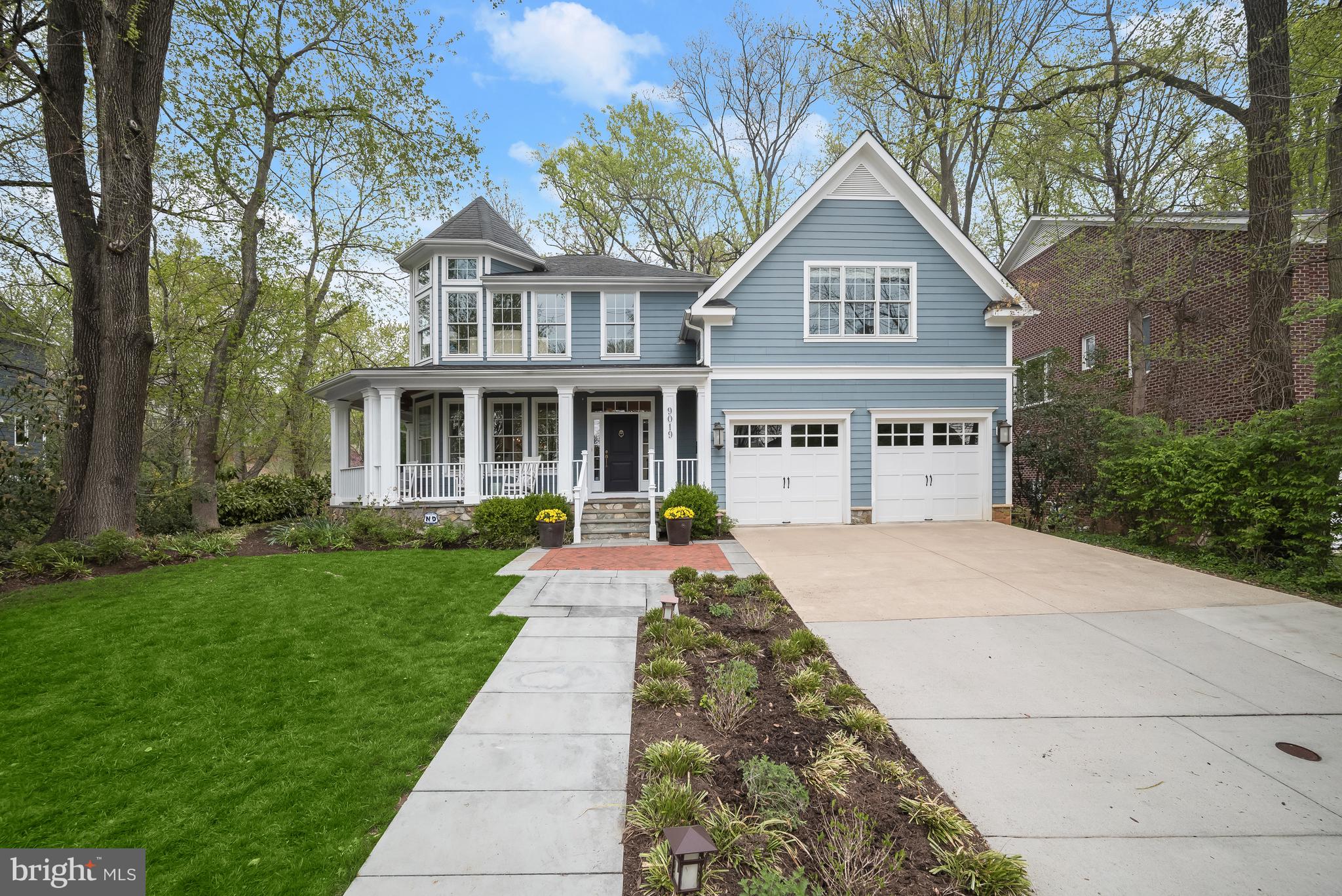 **Incredible New Price!** Nestled on a tree-lined street in Ayrlawn neighborhood, 9019 Lindale Drive showcases elegant curb appeal paired with stunning interior features and curated amenities. A Beauty, this Custom Colonial presents 5 Bedrooms, 4 Full Baths and 1 Half Bath across 3 levels and 6,386 square feet of living space, boasting Main and Upper Level hardwood floors and custom millwork, paired with designer fixtures, recessed lighting and built-ins throughout.

9019 Lindale Drive boasts a landscaped Front Yard, views of the turret feature, a driveway leading to the attached, front load 2-Car Garage, the slate front path and stone steps leading to the wrap around Front Porch, with slate flooring, wood beadboard ceiling and ceiling fans. The Entry Foyer boasts beautiful sconces, classic bell jar light fixtures and a coat closet. The Entry Foyer also leads to the Main Level Powder Room with a square console sink, designer mirror and chandelier. The Living Room showcases breathtaking windows with views of the Front Yard and access to the Side Porch. The Dining Room presents wainscoting and a bespoke brass chandelier. The Island Kitchen boasts white marble counters with tile backsplash, premium appliances, pendant lighting, warm wood counter island seating and a pantry closet. The Breakfast Area follows, showcasing display cabinets, Rear Patio access and a desk/work station with marble top. The Family Room, open to the Kitchen, showcases a coffered ceiling, Rear Patio access and a gas fireplace, flanked by recessed bench seats and windows. The Rear Hall leads to the Office and Mudroom, complete with Garage access and a coat closet. The Office offers double French door entry, a coffered ceiling, a lighted ceiling fan and Mudroom access. 

Ascending to the Upper Level, the Upper Hall, complete with a linen closet, leads to the Primary Bedroom Suite, boasting a triple window overlooking the Rear Yard, a gas fireplace, a Primary Sitting Room with a private balcony, in addition to an ensuite Primary Bath. The Primary Bath truly is a serene retreat; complete with marble tile flooring, dual vanity with marble counters, custom mirrors, 2 medicine cabinets, a make-up vanity, a free-standing tub with a handheld shower, a stall shower with marble tile flooring and a bench seat, a water closet with a Kohler toilet and bidet and 2 outfitted walk-in closets. The Second Bedroom presents French door entry, a lighted ceiling fan, light fixture and a captivating turret. The Jack and Jill style Full Bath connects the Second Bedroom to the Third Bedroom and includes octagonal tile flooring, a linen closet, square Kohler pedestal sink and medicine cabinet, a separate room with a tub shower with tiled surround and toilet and a second square Kohler pedestal sink and medicine cabinet. The Third Bedroom showcases a walk-in closet and a spherical wire chandelier. The Fourth Bedroom boasts a walk-in closet, attic access and an ensuite Full Bath, including tile flooring, a tub shower, a handheld shower head, a mirrored medicine cabinet and single vanity. The Upper Level’s offerings are complete with a Laundry Room offering tile flooring, a front load washer and dryer, utility sink and shelves.

Descending to the walk-up, newly carpeted Lower Level, the Recreation Room awaits, offering space for a pool table, TV area and more! The Fifth Bedroom includes a full window, a walk-in closet and light fixture and adjoins the Full Bath with a tub shower. The Lower Level is complete with an Exercise Room with a mirrored wall, a large, shelved, storage closet, 2 Utility Rooms, one including a sump pump and an exit to the Rear Yard. 

Backing to parkland and lined with picket fencing, the slate Rear Patio and Yard is a verdant, private oasis.

In close proximity to Ayrlawn Park with tennis courts, athletic fields and playground, the YMCA, Bradley Park and North Bethesda Middle School, 9019 Lindale Drive offers residential bliss! Schedule a visit today!