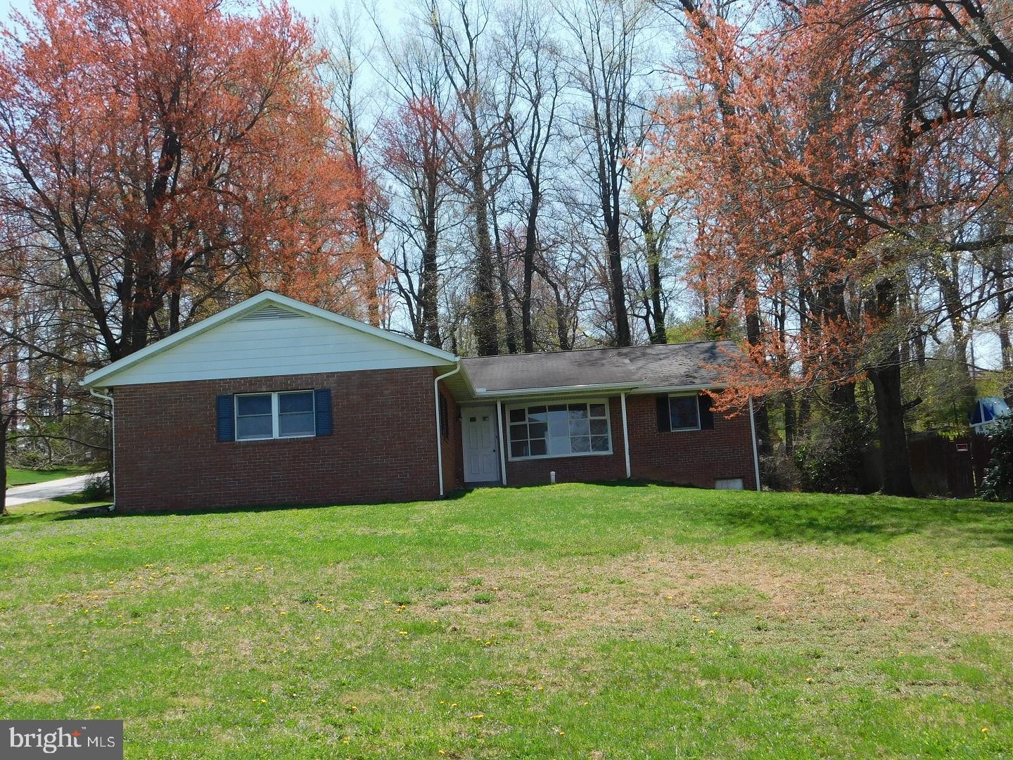 Great location on the edge of town for this one owner brick rancher on wooded corner lot. Great view of farmlands and meadow. Priced to sell.