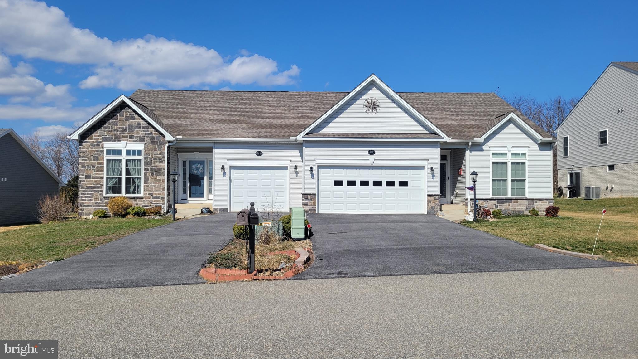 Better Than New - Check this lovely villa featuring open floor plan,  2 bedrooms, & 2 full baths.    Gourmet kitchen with granite countertops, large island & tiled backsplash, GE appliances, corner pantry & pendant lighting over large island - perfect for cooking and entertaining.    Relax in the family room with cozy gas fireplace or enjoy the bright sun room addition with ceramic tile floor, and windows all around ($30,000 add-on), filling the home with natural light.    Additional highlights include convenient main level laundry, 9' ceilings, custom window treatments throughout, & full unfinished basement for expanding.   Located in desirable Active Adult Community 55+.  County taxes only and no HOA!   Nestled on back side of Freedom Hills, lot is bordered by trees in rear for maximum privacy....so nice to come home to.   Shows beautifully and clean as a whistle.  County taxes only and NO HOA.   Ready to welcome it's next owner.   Call to schedule to see!