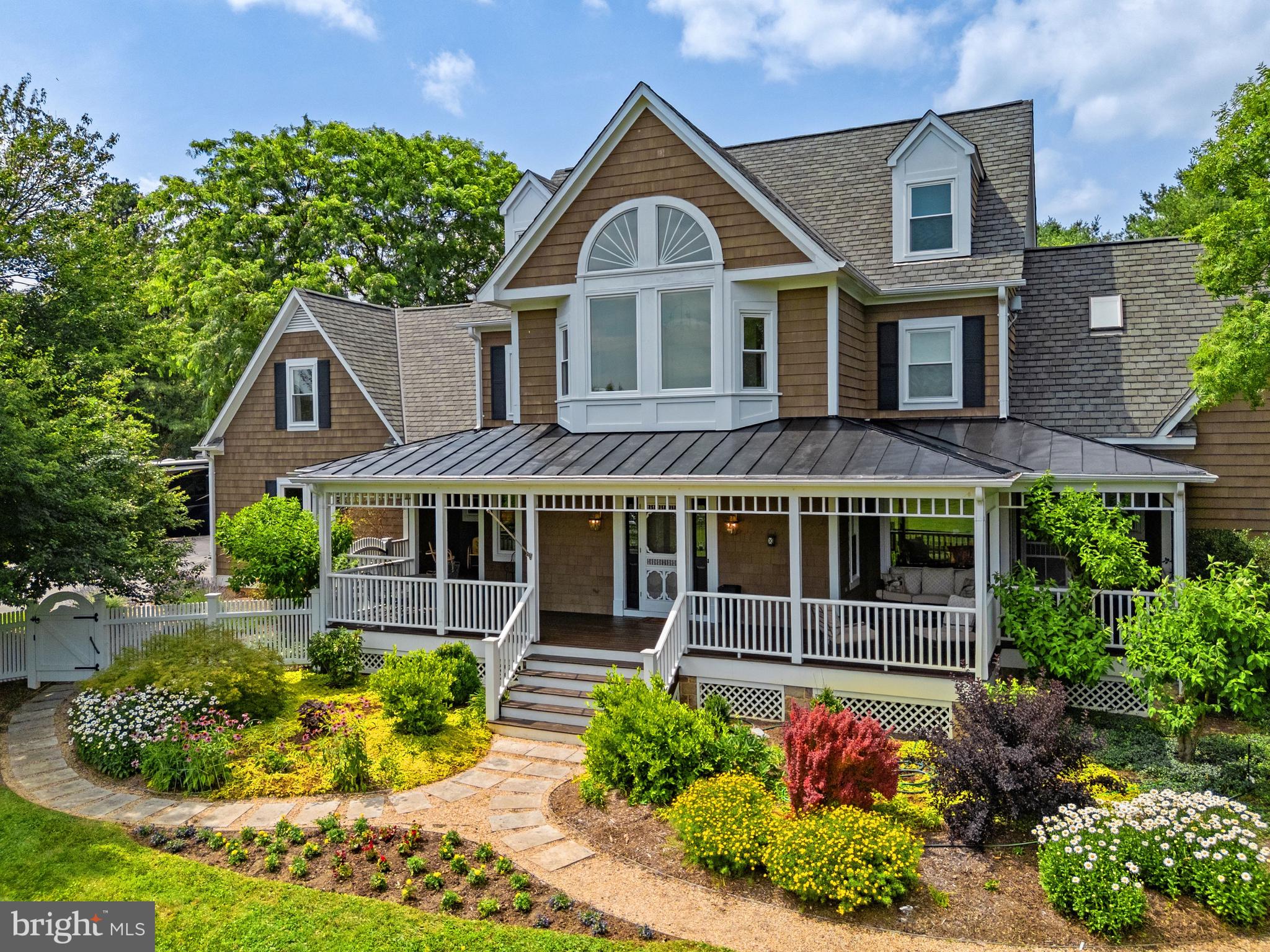 Surrounded by scenic countryside and beautifully landscaped grounds, BelVento is a thoughtfully updated residence that blends timeless character with modern comfort. 

Welcoming front and rear porches invite you to slow down and enjoy the peaceful surroundings, while updated walkways and fencing enhance both the beauty and functionality of the grounds. 

At the heart of the home, a stunning renovated kitchen serves as the centerpiece for everyday living and entertaining. Designed with both beauty and performance in mind, the space features premium Waterworks fixtures, marble countertops and sink, and an impressive suite of professional-grade appliances, including a BlueStar six-burner range,BlueStar refrigerator, Asko dishwasher, and Bosch warming drawer. Just beyond, the cozy breakfast area and spacious family room are warmed by two wood-burning fireplaces with striking stone mantels and hearths, creating inviting spaces to gather with family and friends. The main level is further enhanced by elegant formal living and dining rooms adorned with refined custom millwork that beautifully flank the entry foyer. A recently updated powder room adds both style and convenience, while a generously sized mudroom, ideally situated just off the garage with direct access to the front and rear porches, provides a practical everyday entry for busy households.

The spacious floor plan offers five bedrooms and three updated baths on the upper level including a luxurious primary suite. One of the guest bedrooms could serve as a 2nd primary.

The walk-out lower level provides exceptional flexibility and has been thoughtfully designed to accommodate a variety of lifestyles. French doors open directly to a flagstone area, while a spacious recreation area, full bath, second laundry room with commercial-grade washer and dryer, and dedicated dog wash station make the space equally suited for multigenerational living, hobbies, or pet care.

Throughout the home, extensive updates reflect a commitment to quality and comfort, including new ProVia Energy Star-rated and Marvin windows, beautifully updated baths with marble countertops and smart toilets in the primary and guest baths, enhanced lighting, fresh interior and exterior paint, and numerous mechanical upgrades.

Fully fenced and well maintained, the property is particularly well-suited for animal lovers, outdoor enthusiasts, or anyone seeking space and privacy in the countryside.
Mature landscaping, extensive fencing, and a beautifully designed rain garden create a setting that feels both private and picturesque, while being just ten minutes from Purcellville and fifteen minutes from Middleburg.

Offering an extraordinary combination of thoughtful renovations, modern amenities, and scenic countryside beauty, BelVento presents a rare opportunity to enjoy refined country living in a desirable Loudoun County location.
SEE FEATURES AND UPGRADES LIST FOR MORE DETAILS