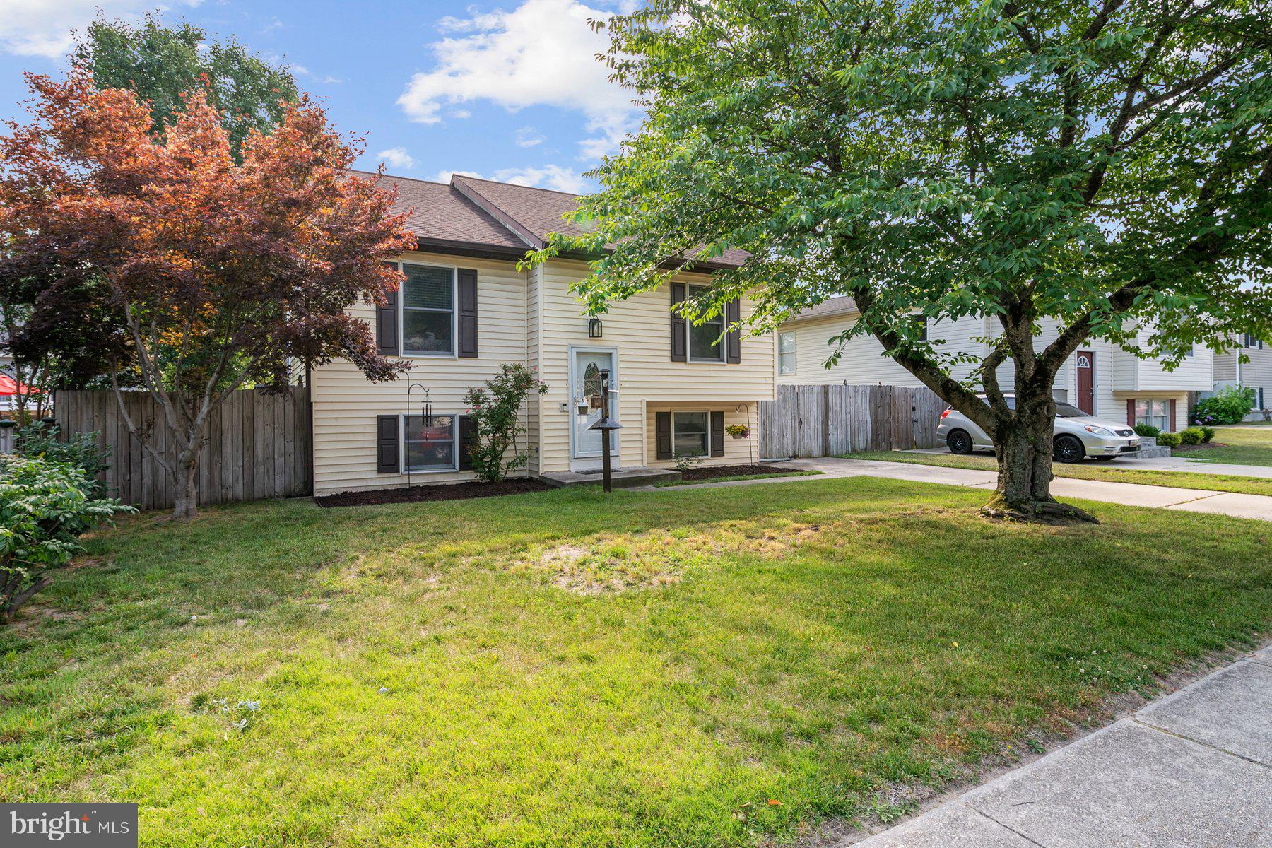 Welcome to this charming split foyer home in the Green Haven community, offering the perfect blend of comfort, flexibility, and functionality. With approximately 1,833 square feet of finished living space, this well-maintained residence features four bedrooms, three full bathrooms, and a layout designed to accommodate a variety of lifestyles.

Step inside to find beautiful hardwood and carpet flooring throughout the main living areas, creating a warm and inviting atmosphere. The eat-in kitchen is equipped with upgraded countertops, stainless steel appliances, and ample cabinet and pantry space, making it ideal for both everyday living and entertaining.

The spacious primary suite offers a private retreat with an expanded walk-in closet created from the original fourth bedroom. This versatile space provides exceptional storage and dressing room functionality while retaining the potential to be converted back to a traditional fourth bedroom, nursery, home office, or sitting room if desired.

The fully finished lower level expands the home’s living space and features a pellet stove that provides warmth and ambiance, making it an ideal setting for a family room, recreation area, home office, or guest space. Convenient walkout access connects the interior to the backyard.

Outside, enjoy a patio that provide great spaces for relaxing, grilling, or social gatherings. The backyard offers plenty of room for outdoor activities, gardening, or pets. A standout feature of the property is the spacious shed, complete with electricity and a built-in workbench, making it perfect for hobbies, projects, storage, or workshop use.

Additional highlights include a concrete driveway, off-street parking, and a convenient location close to shopping, dining, schools, parks, and commuter routes.

Offering a flexible floor plan, thoughtful updates, and plenty of indoor and outdoor living space, this Green Haven home is ready to welcome its next owners.