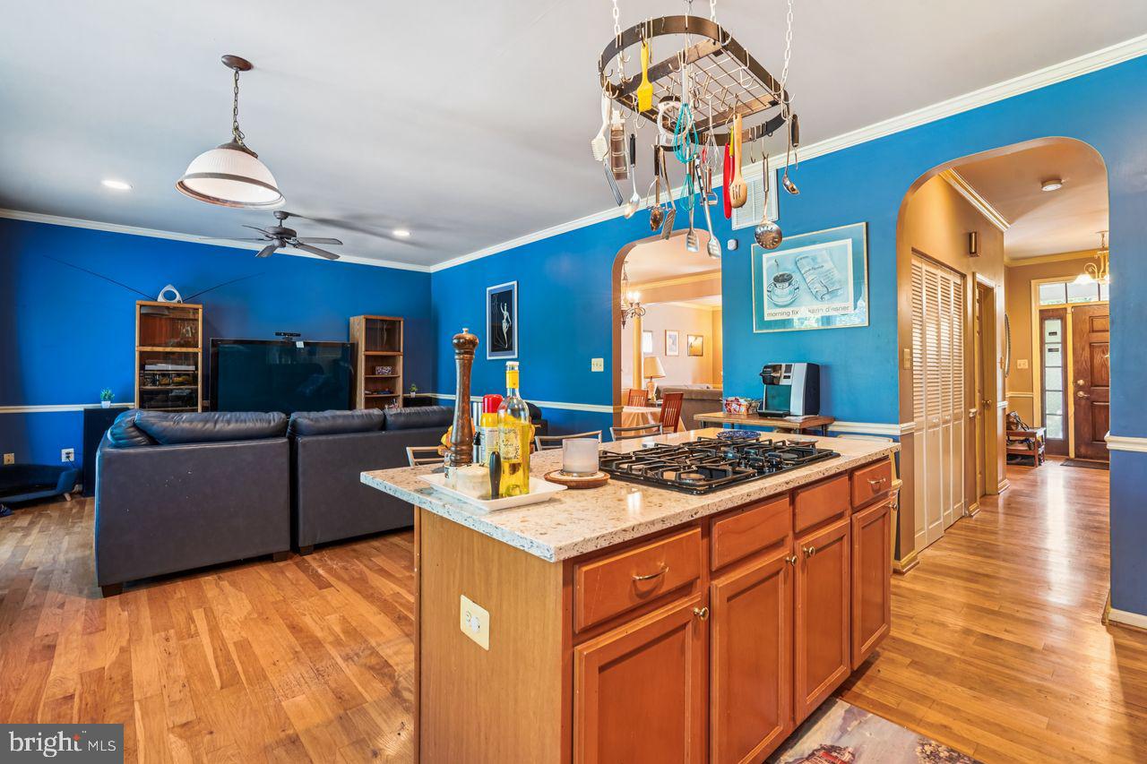 NEW BELOW-MARKET LIST PRICE!  Welcome to this Contemporary beauty in sought-after Takoma Park.  This spacious home features approximately 3,290 square feet of finished living space with four bedrooms and three and a half bathrooms on three levels.  The primary bedroom on the upper level has a full bathroom and a walk-in closet, and there are three additional sizeable bedrooms on that floor.  The home's kitchen is equipped with quartz countertops, maple cabinets, a wall oven and a 5-burner gas cook top in the center island.  A kitchen bay window has a view of the rear deck and back yard. The kitchen overlooks a cozy family room, with glass doors to the generous deck and the large, flat, fenced back yard that offers a storage shed, a patio and garden beds for flowers and vegetables.  The home has 9-foot ceilings, hardwood floors (oak and Brazilian cherry wood), chair and crown moldings, and a first-floor laundry closet and half-bathroom.  
Additionally, the home has a separate in-law suite that offers additional bedroom options, a full bathroom, and a kitchenette.  The home is heated by a 2-zone gas system and has central air conditioning. This home blends comfort and convenience in a quiet setting. The neighborhood has a community garden and children's play lot, is one mile to the Takoma Metro Station, and is a short commute to restaurants, shops and entertainment in downtown Takoma Park, Silver Spring and DC.  A home warranty is being offered by the Seller.  There is a lot to see here.  Welcome Home!!